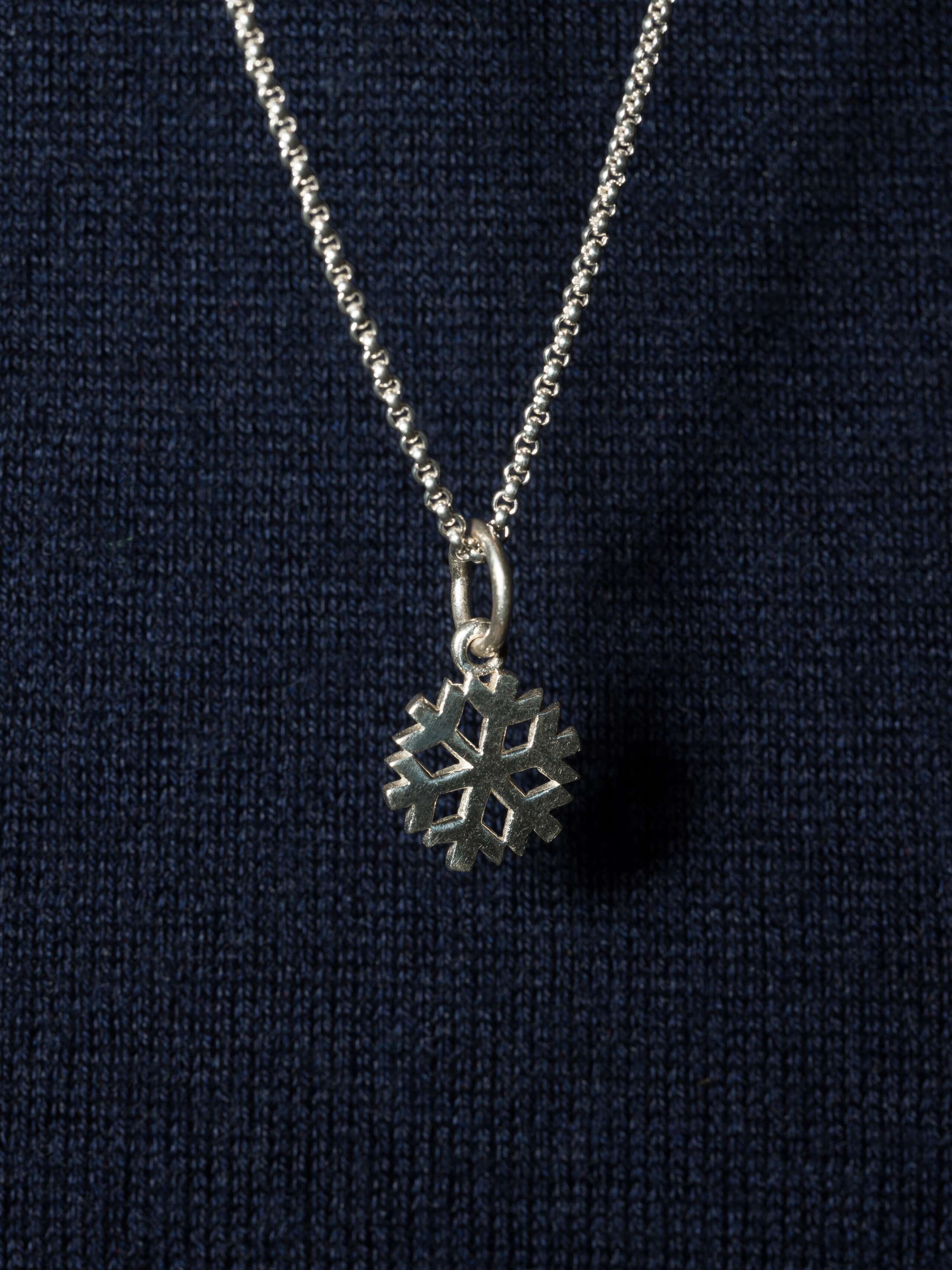 Beautiful silver pendant in snowflake shape