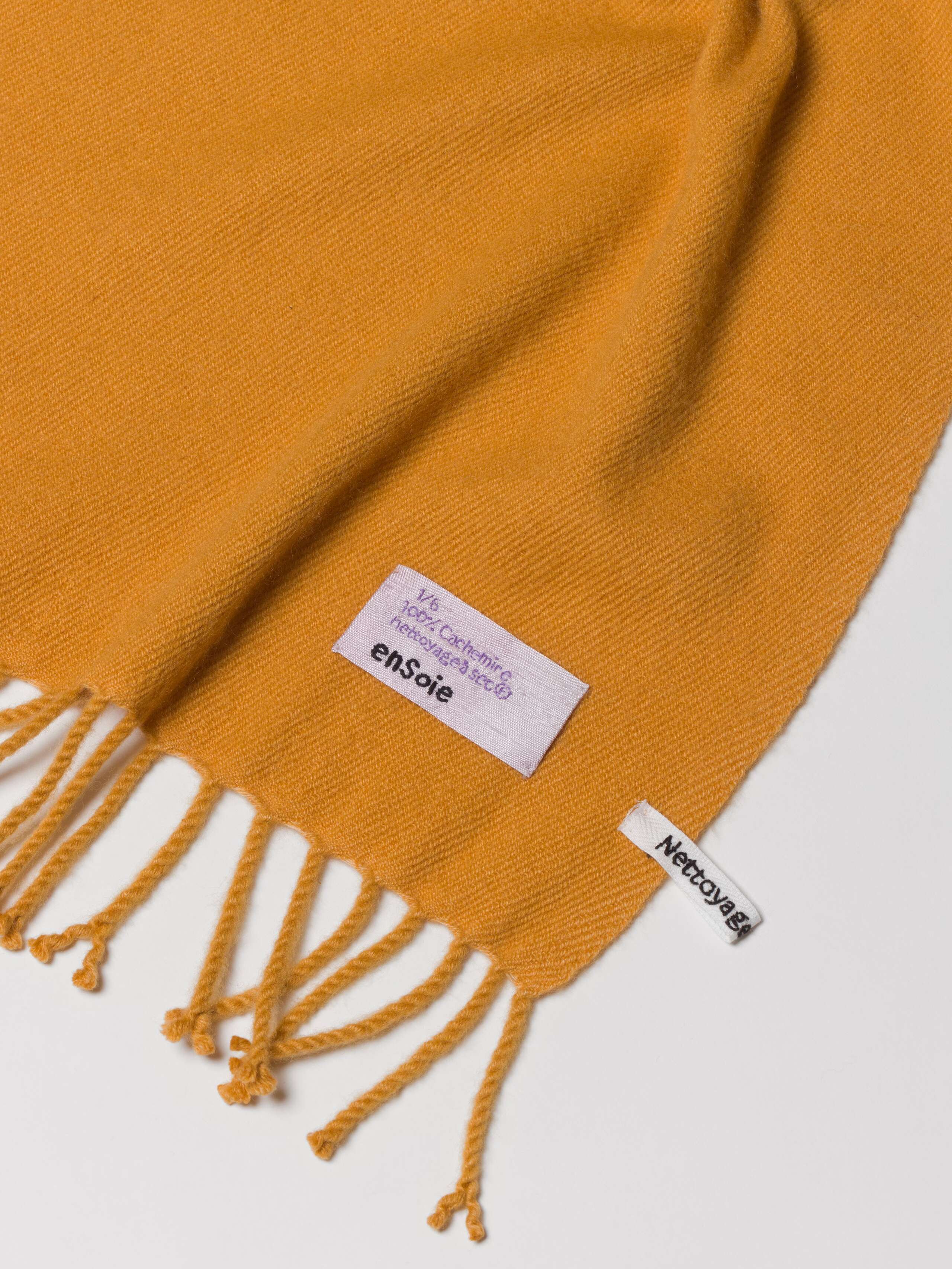 Picture of a detail of a yellow cashmere stole