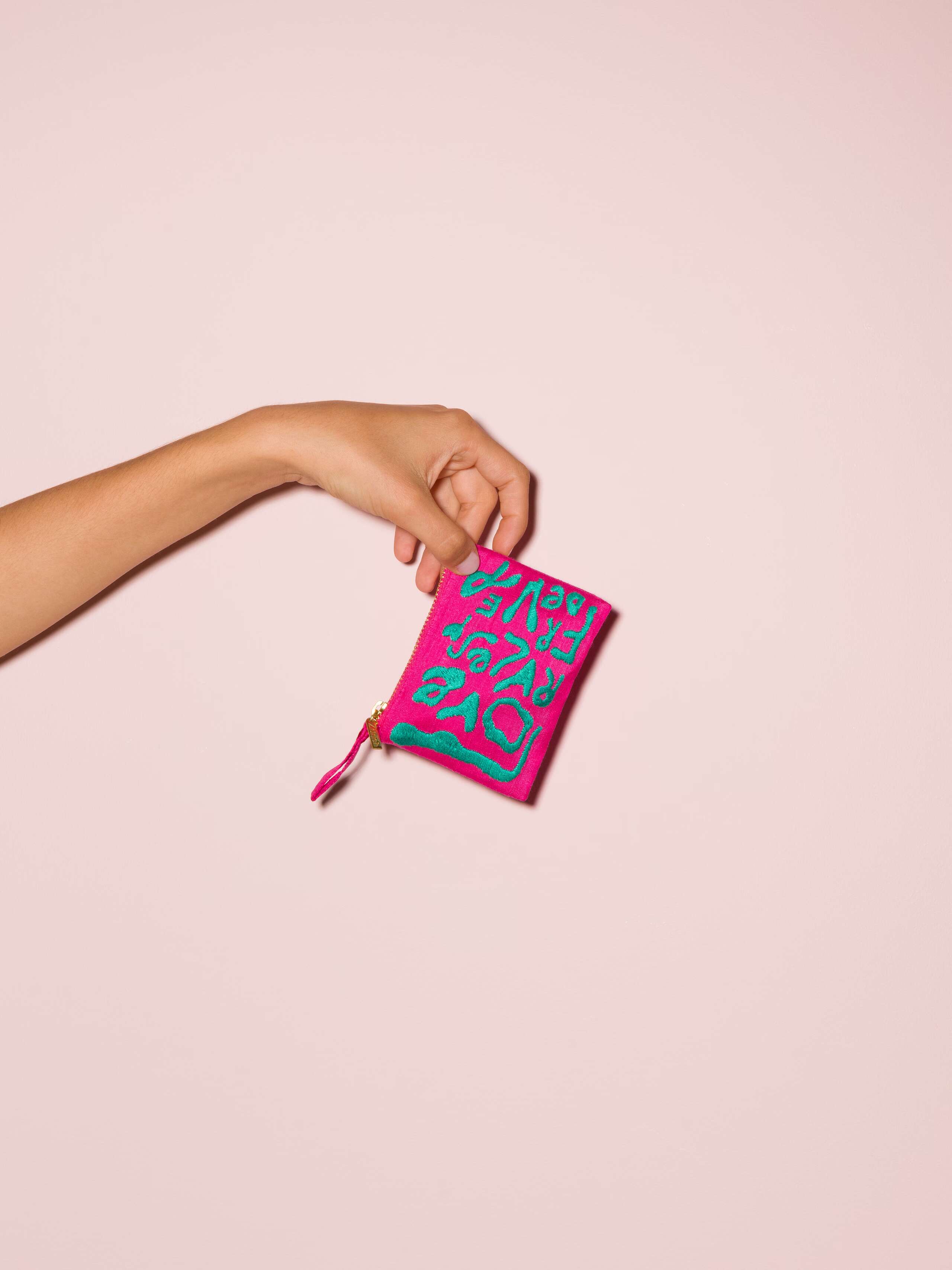 Picture of a small pink silk clutch