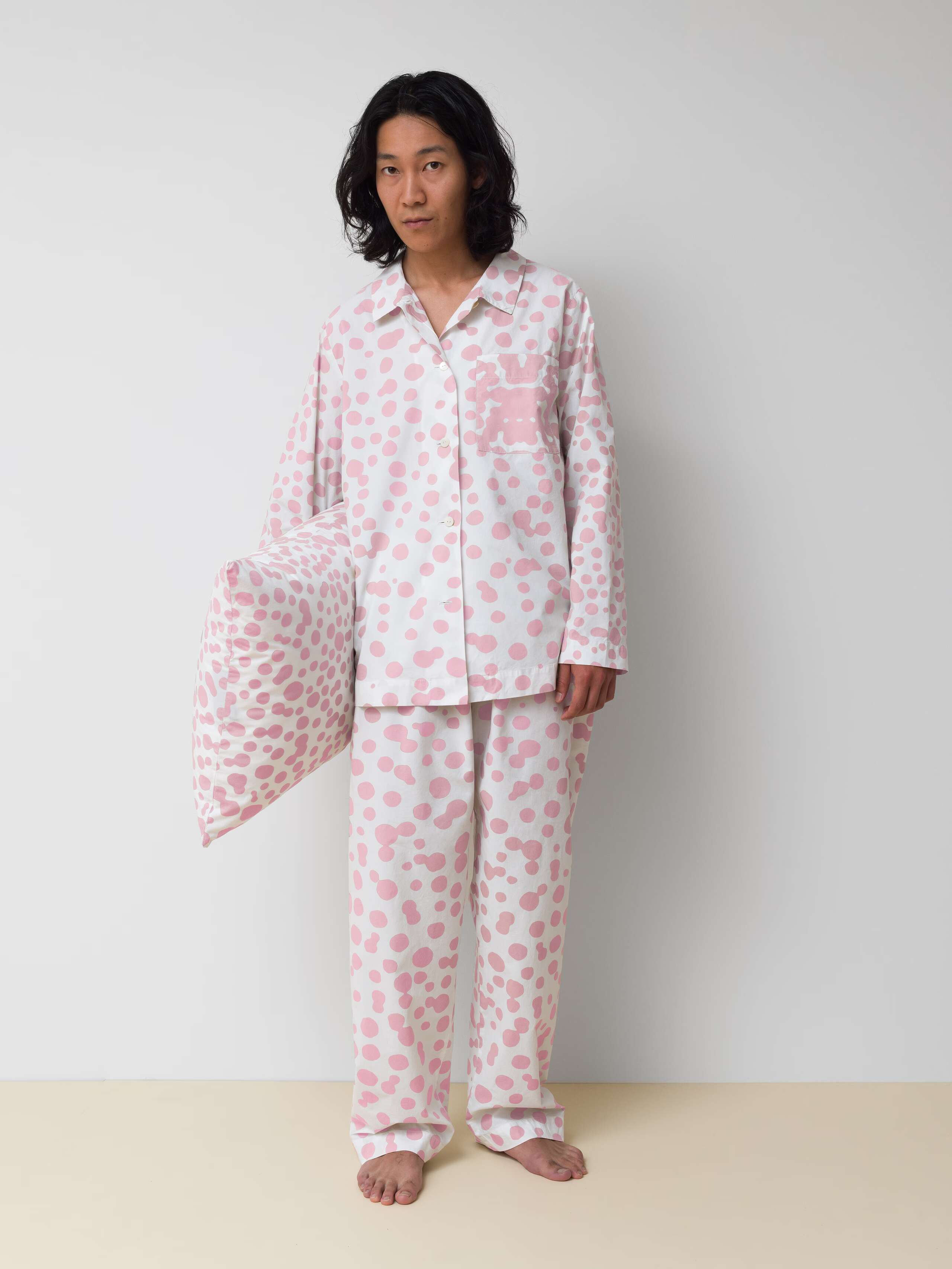 Picture of a man wearing a cotton pyjama featuring pink dots