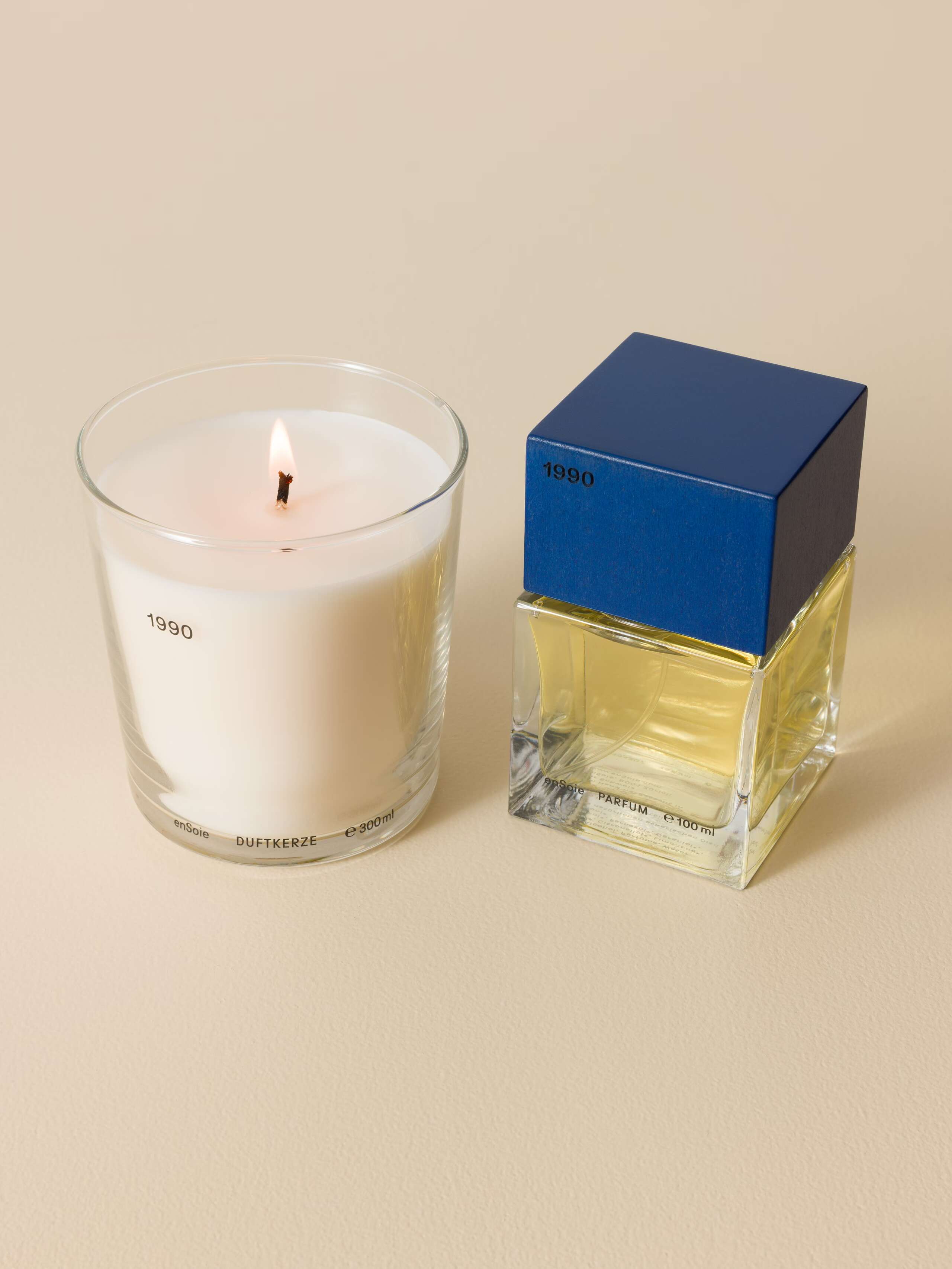Picture of a beautiful scented candle and a perfume