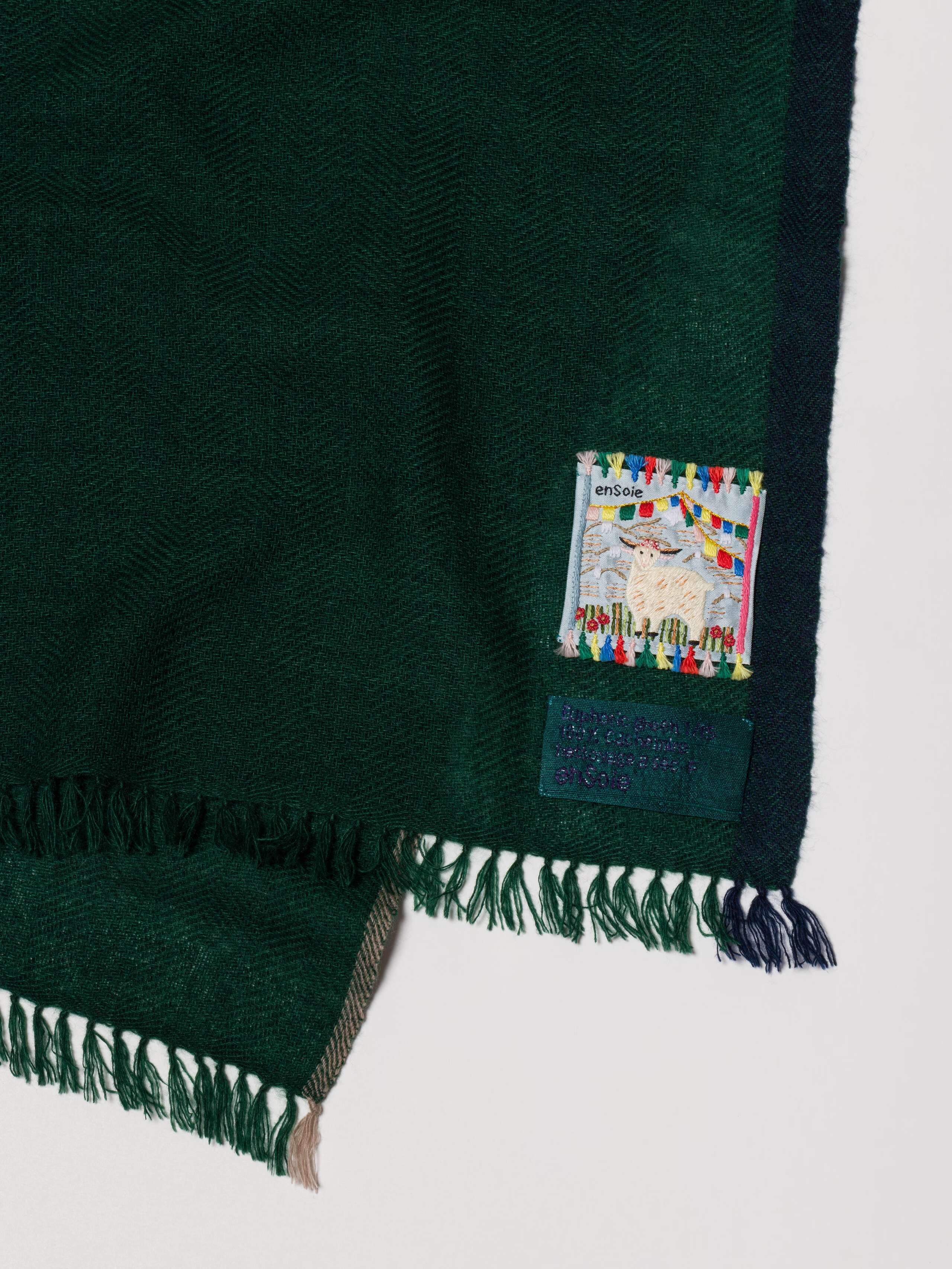 Picture of a small green cashmere scarf 