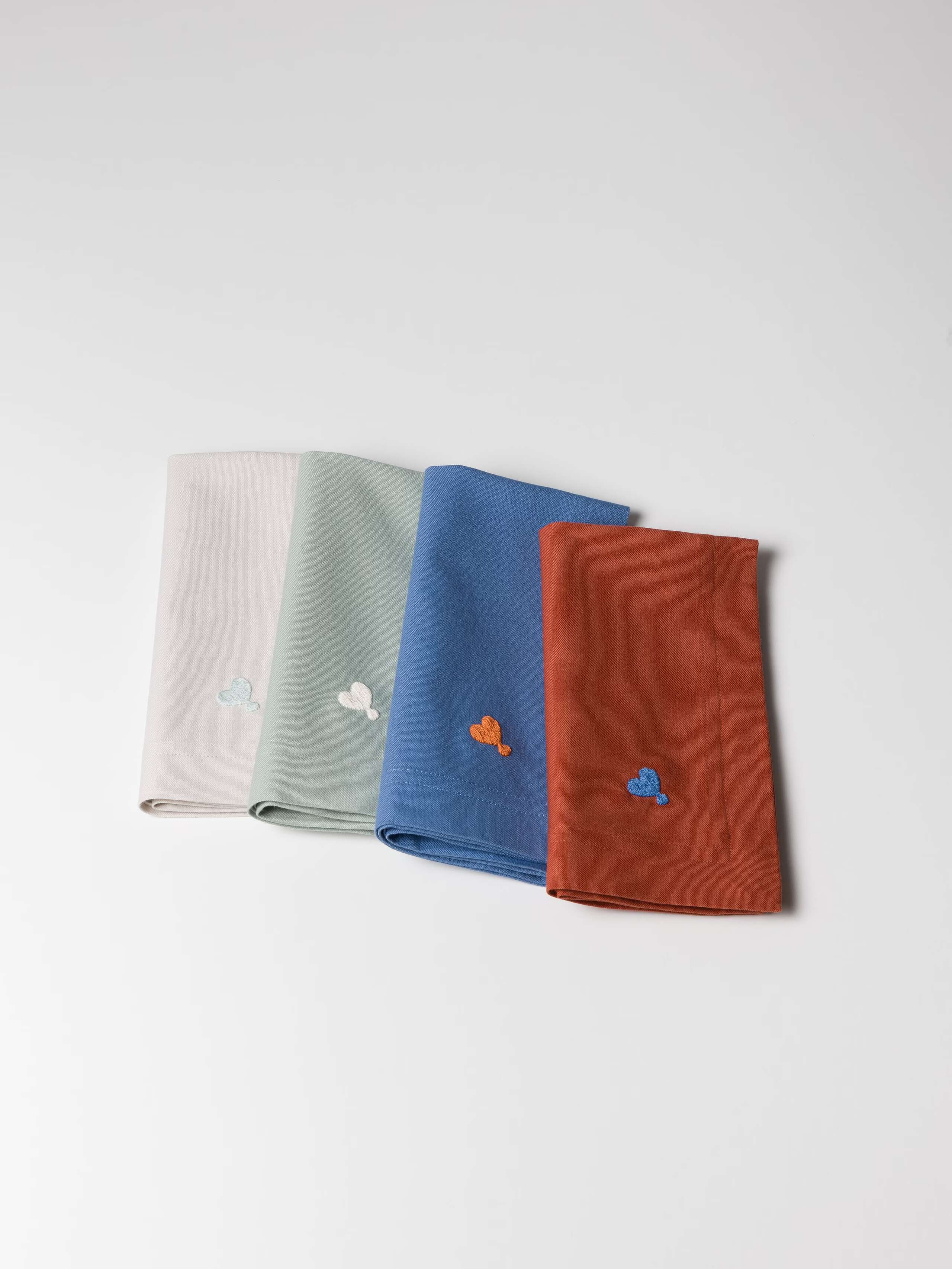 Charles uni napkins in four colours beige sage blue and red