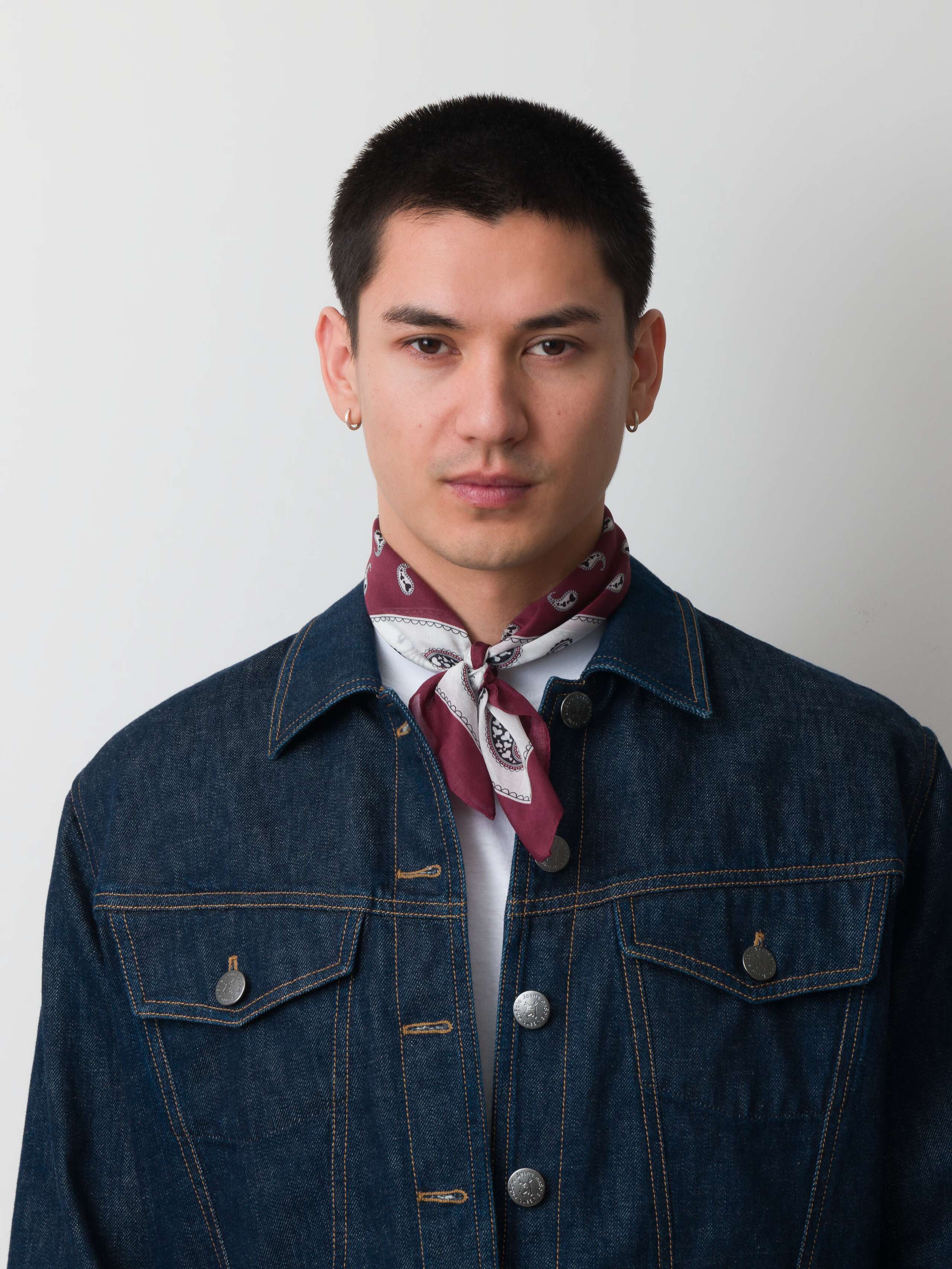Model wearing paisley foulard in dark red