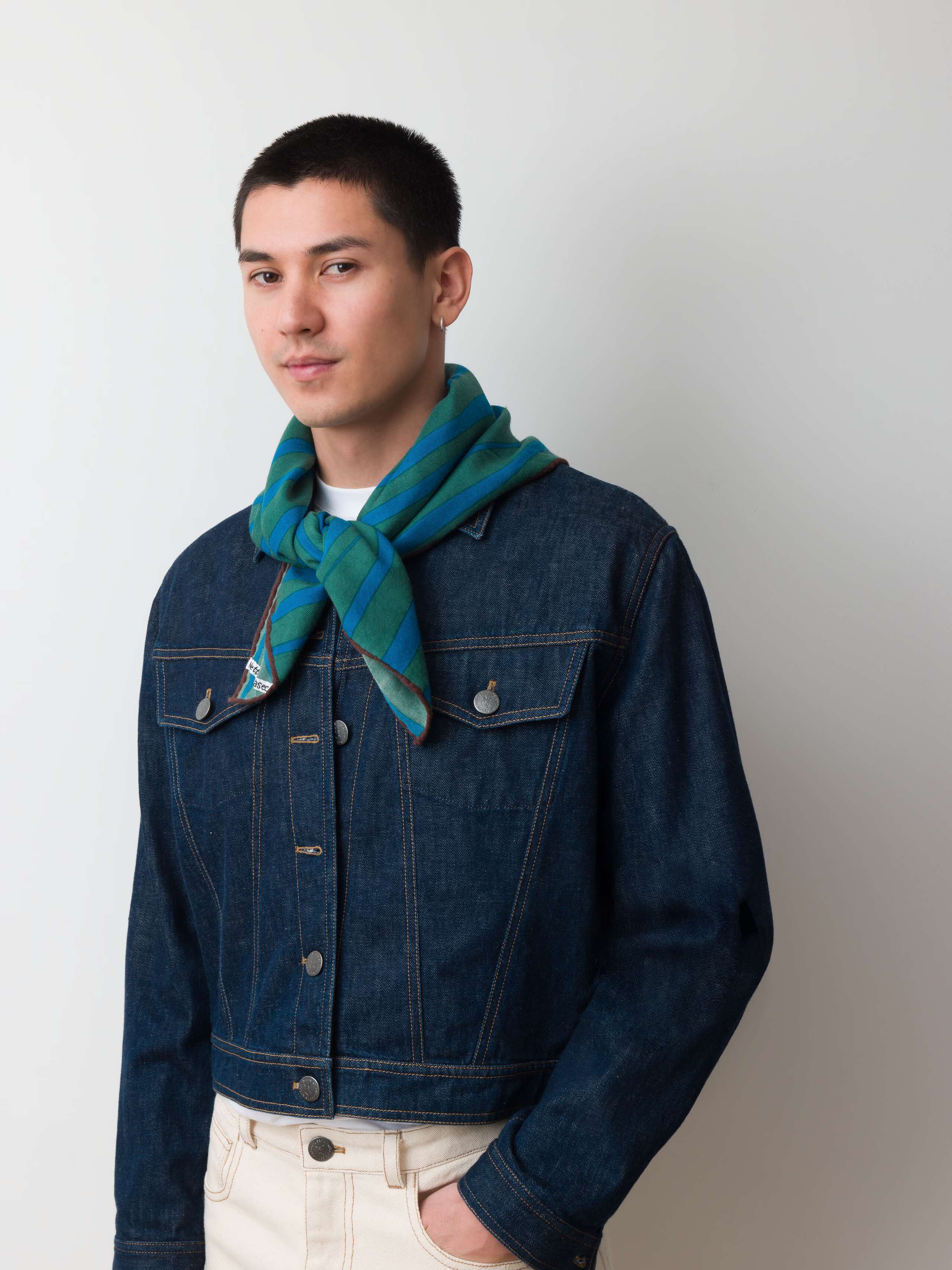 Model wearing green and blue proverb foulard in silk
