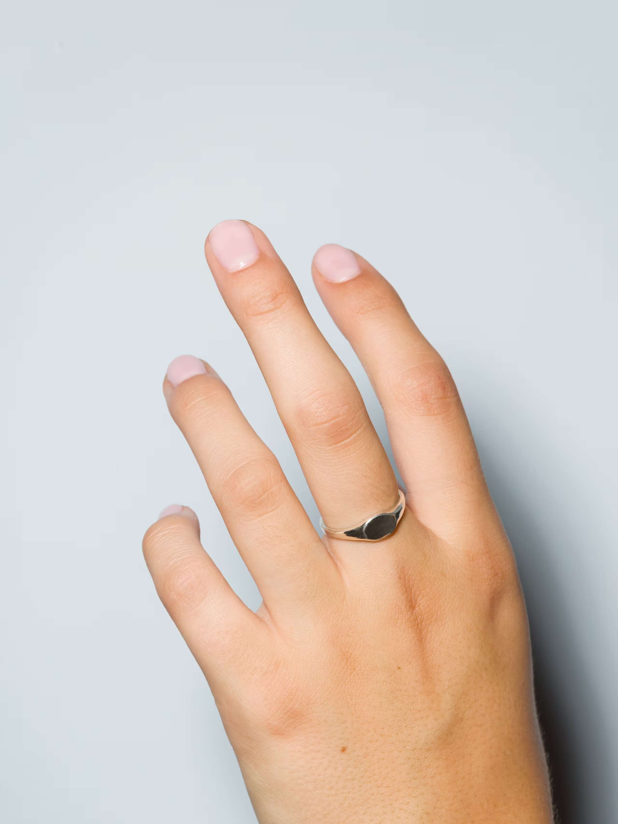 hand showing the ida ring octagon in sterling silver, plain