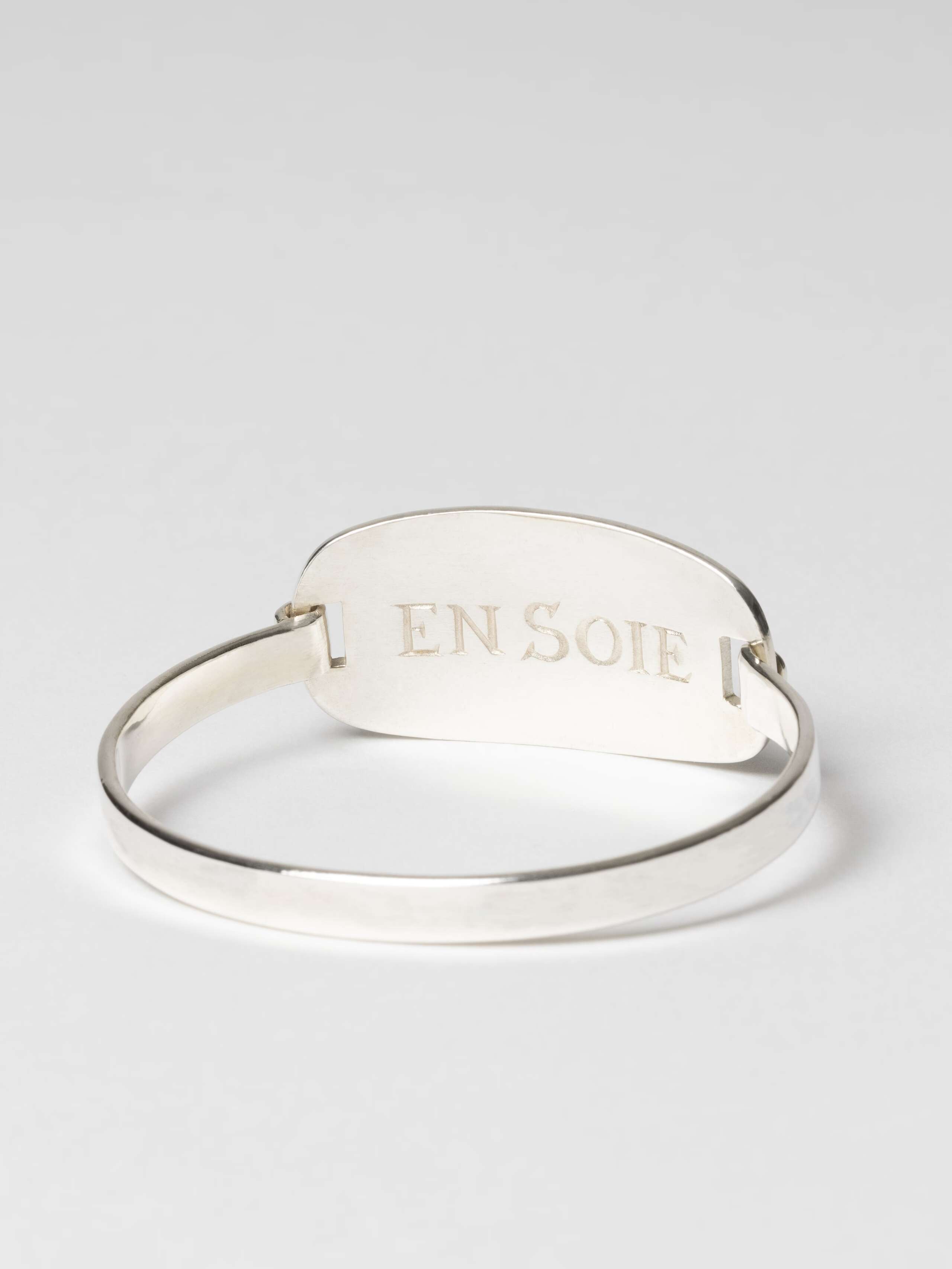 Love Rules Forever Tag Bangle, back view with inside engraving "EN SOIE"