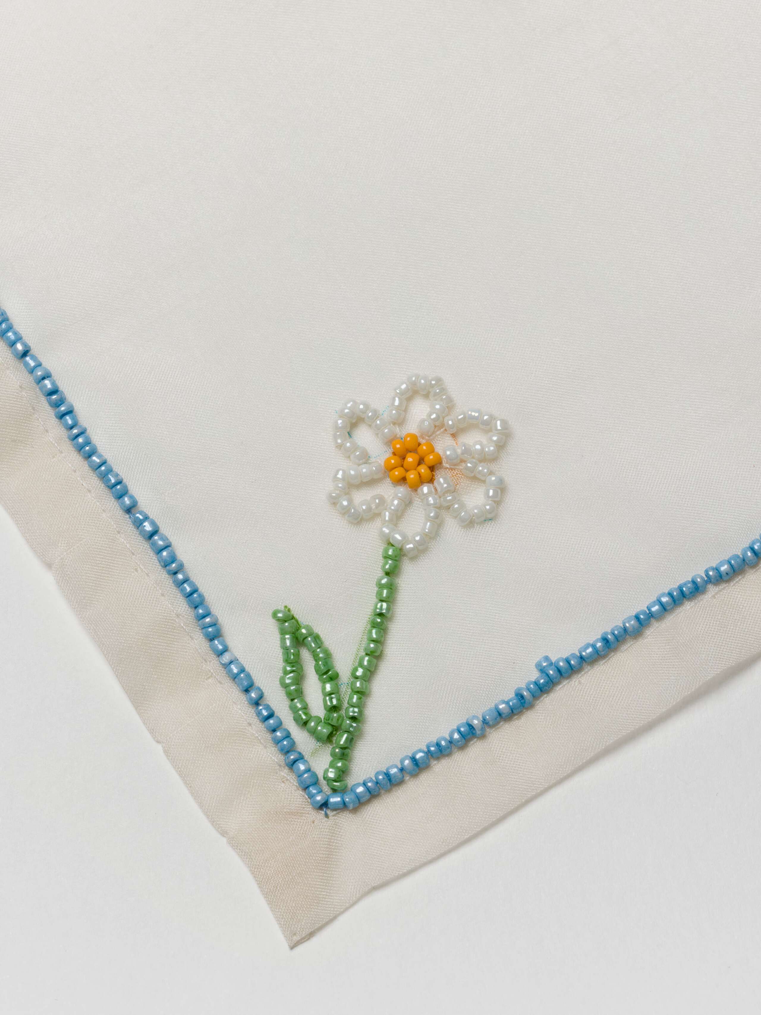 Silk drink cover embroidered and beaded with flowers
