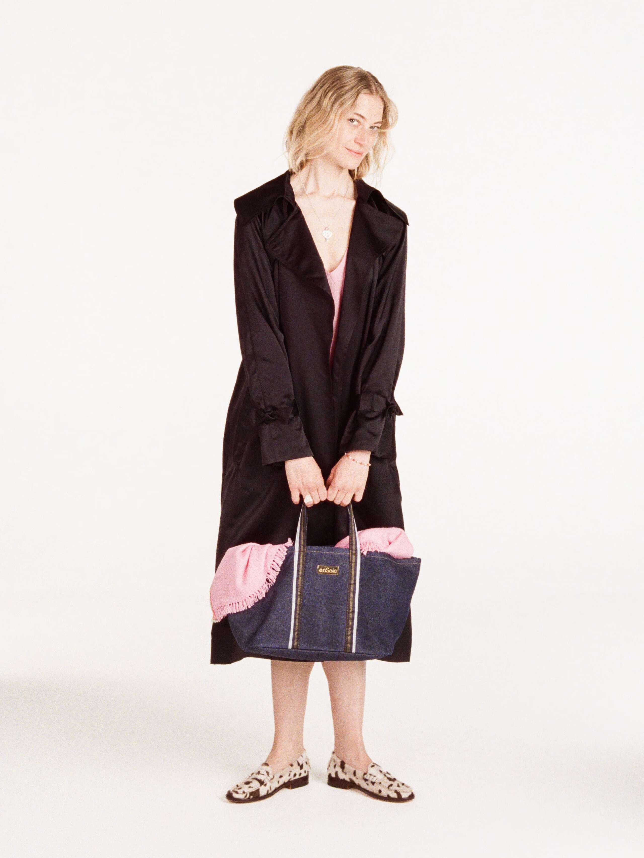 Anna wearing the Manhattan coat in black