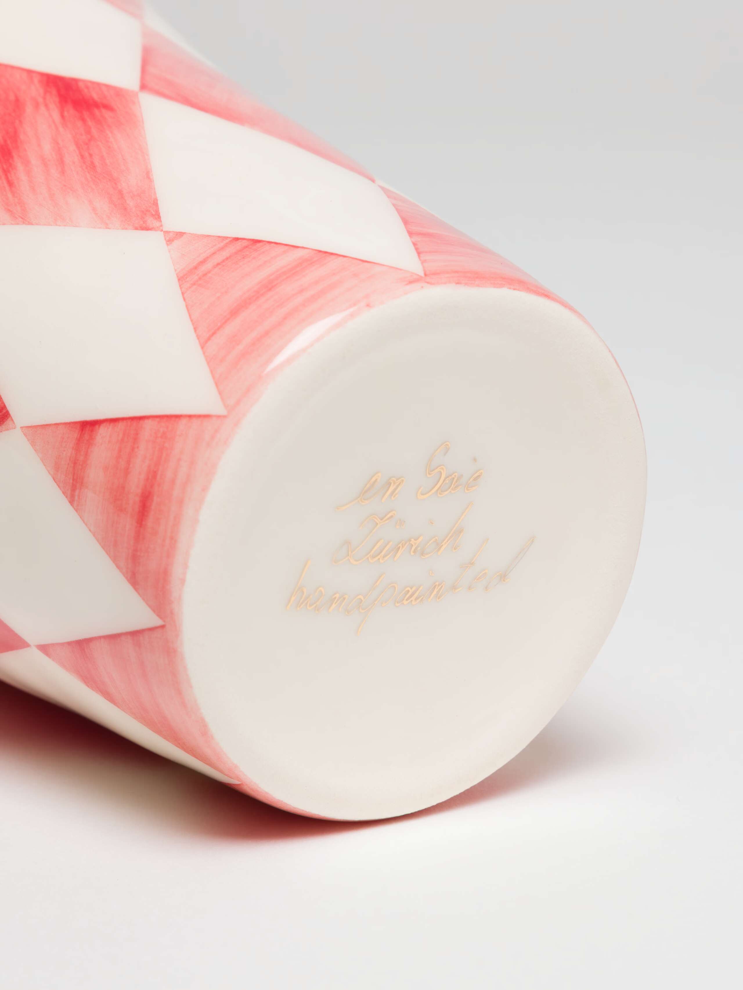 Close up of handwritten signature on bottom of cup