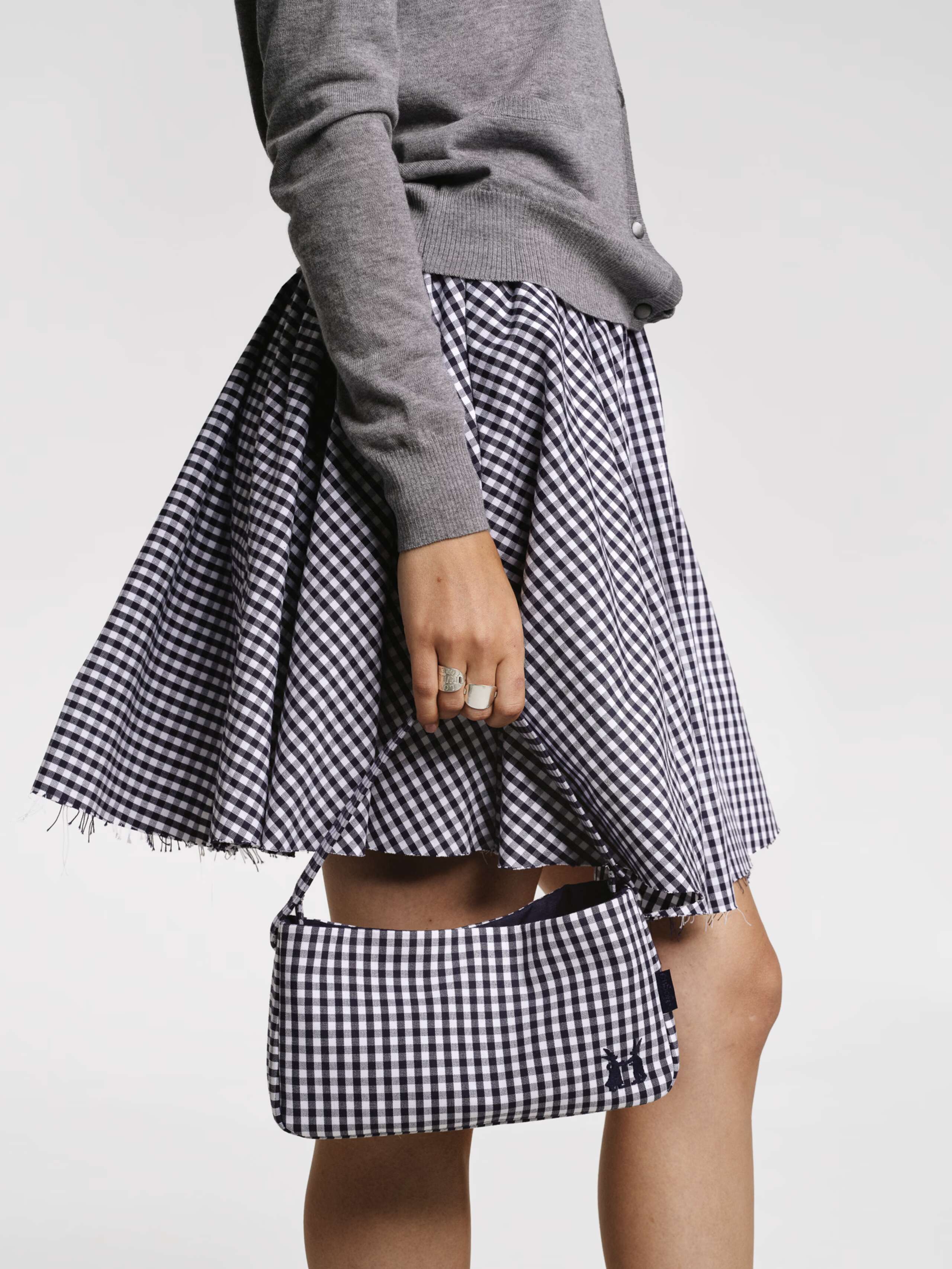Models wearing the Berta short skirt in vichy check red and Navy
