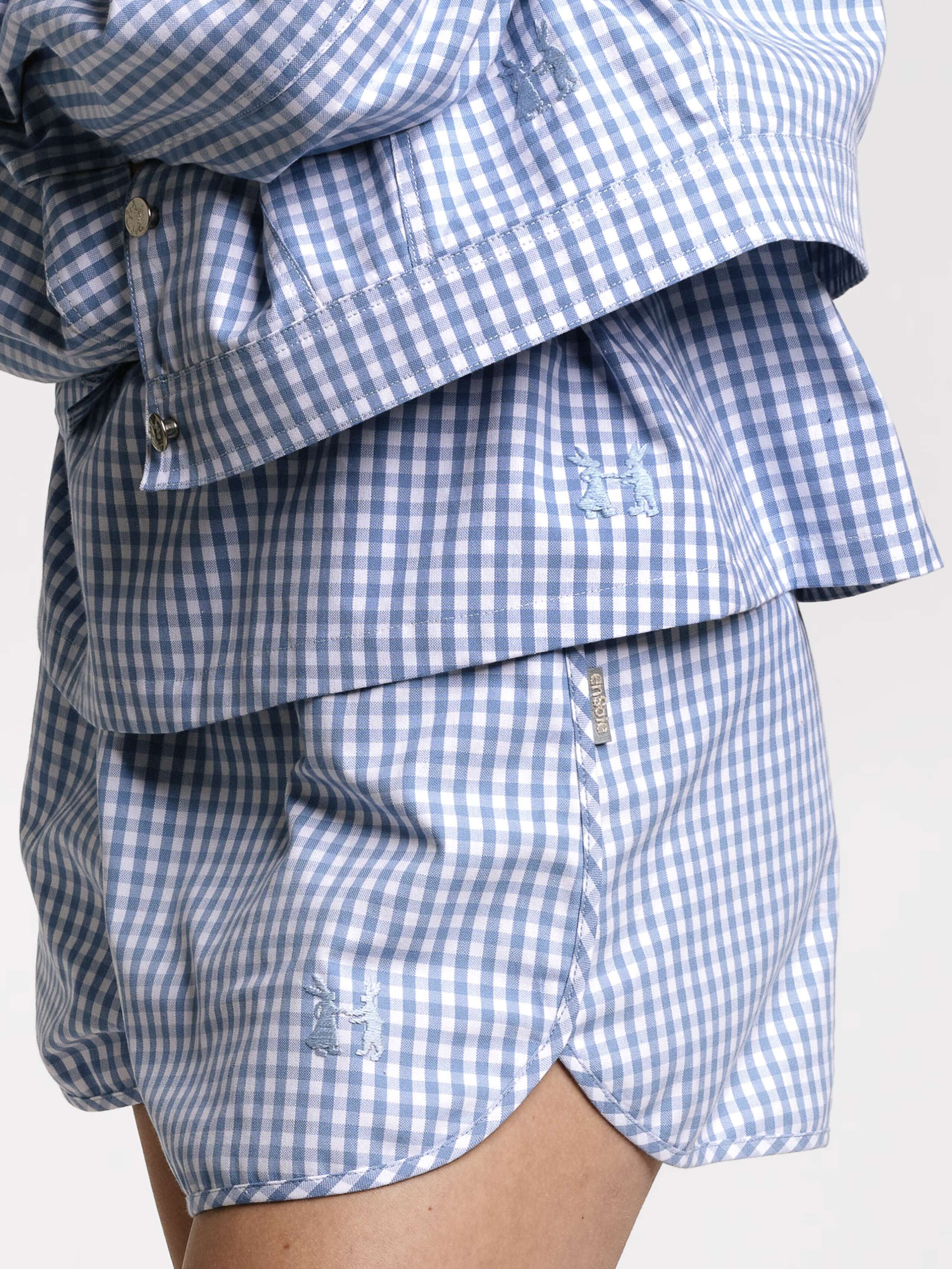 Model wearing the Tia top in light blue vichy