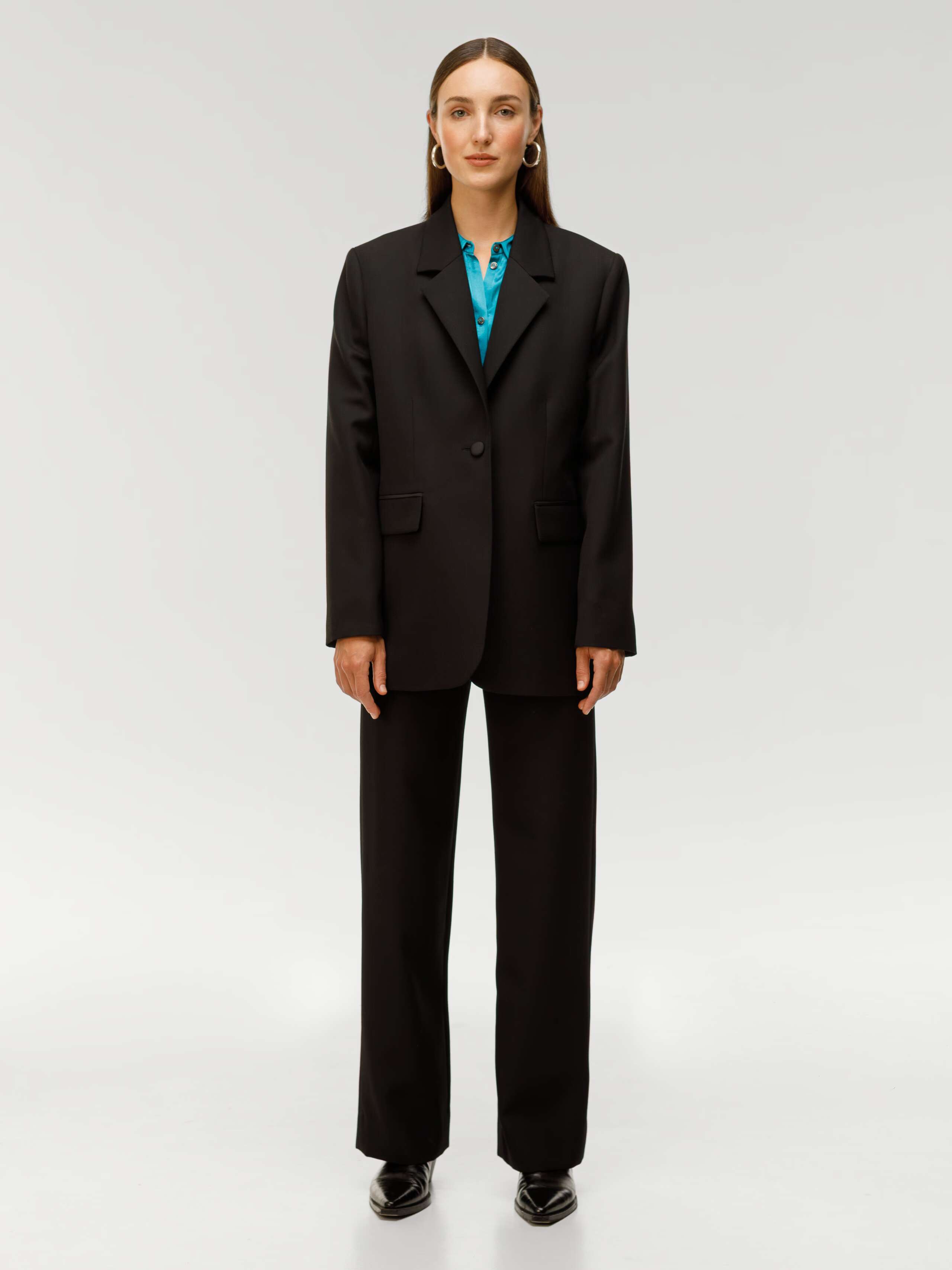 Amy Wool gabardine trousers in black worn by model