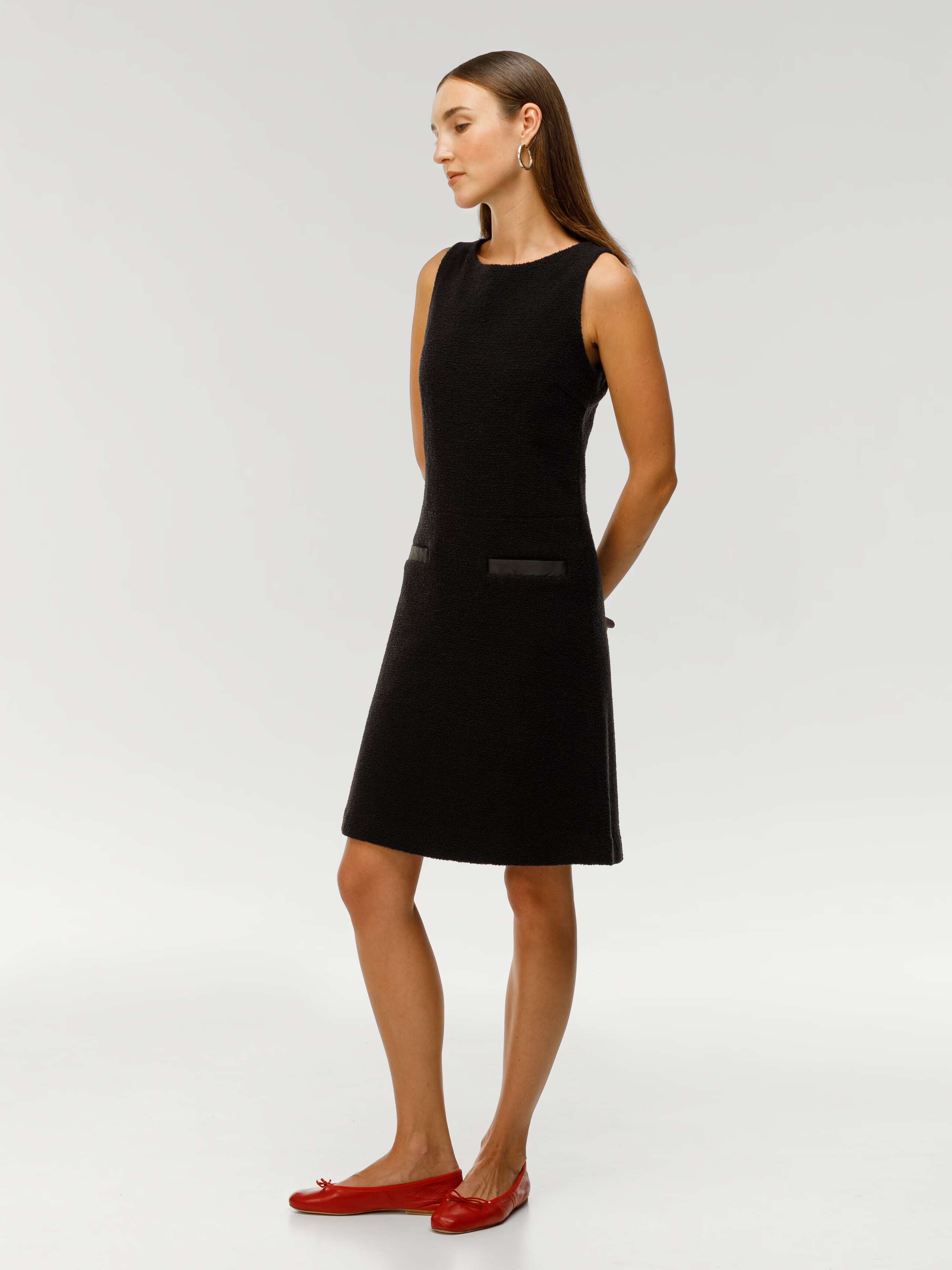 Bellina dress in black bouclé wool worn by model