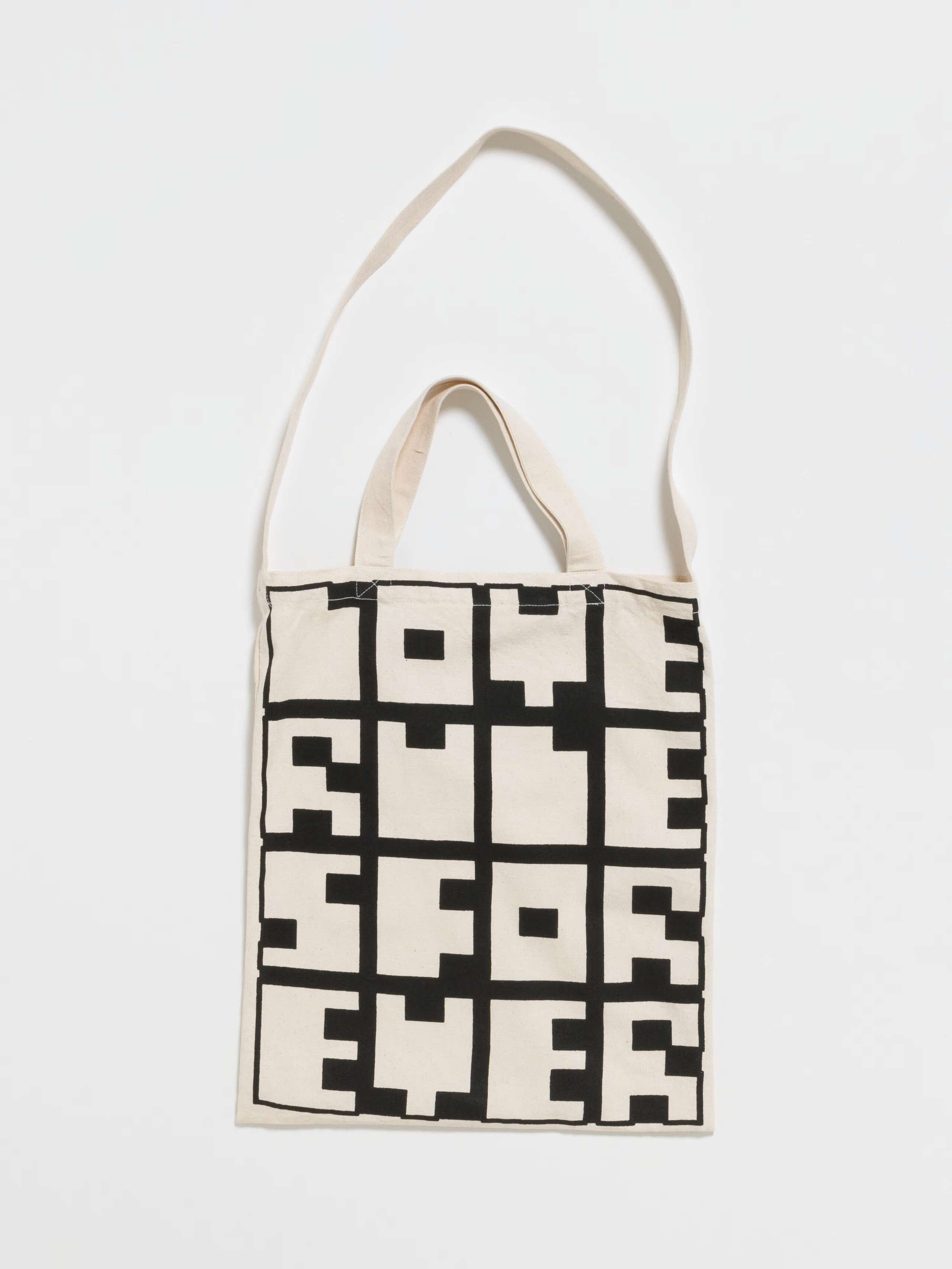 Picture of a tote bag made of heavy cotton fabric featuring a graphic print