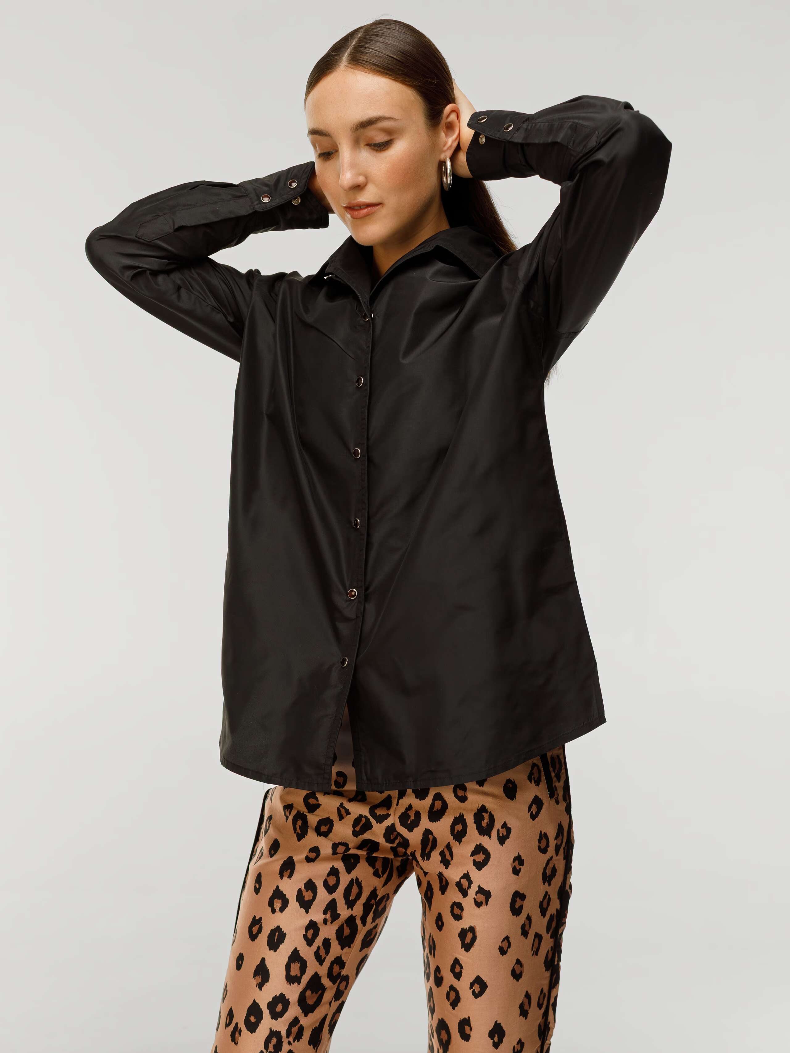 Malin Blouse in black Taffeta silk worn by model