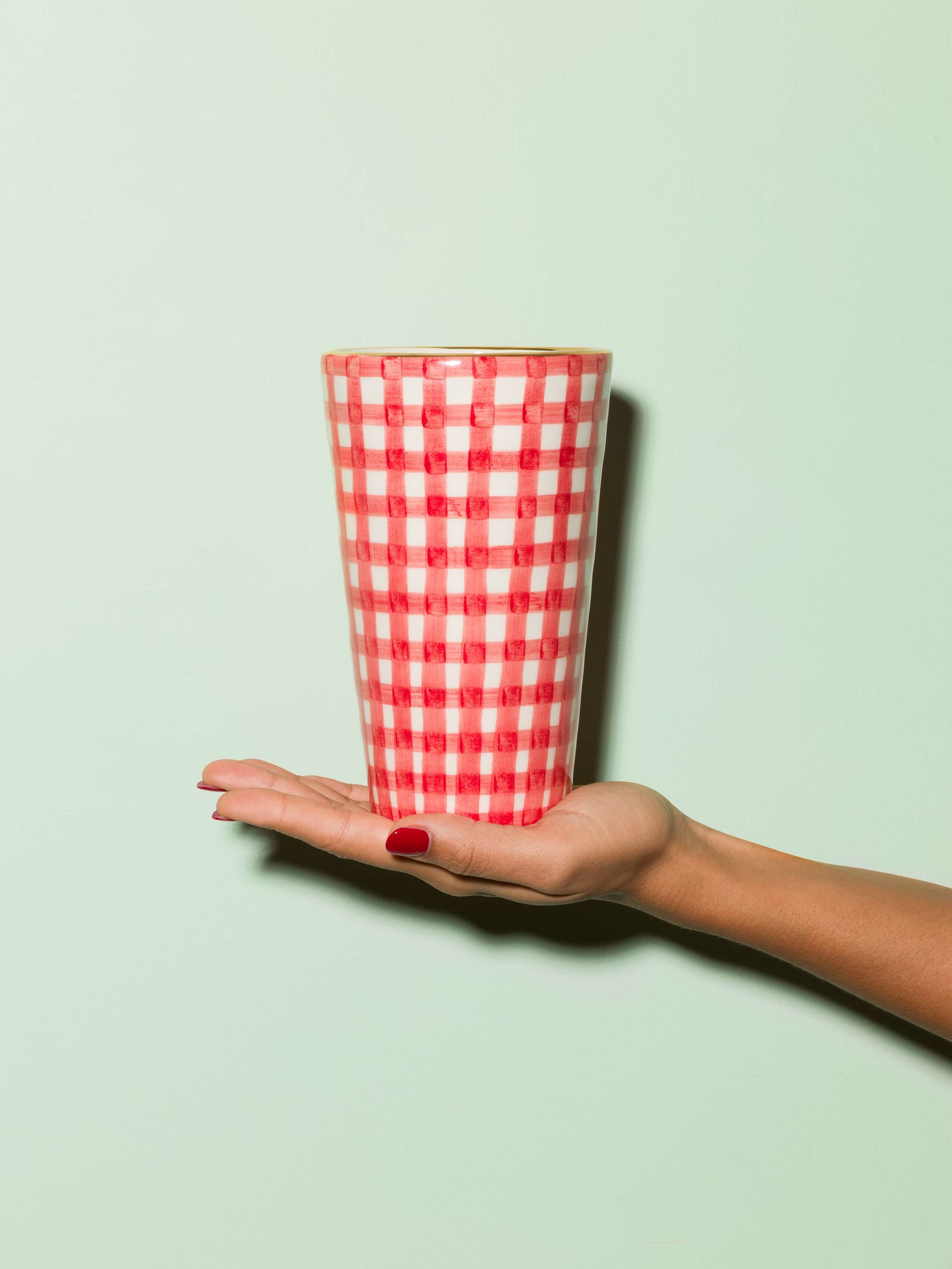Picture of a small vase featuring a beautiful vichy check pattern in red