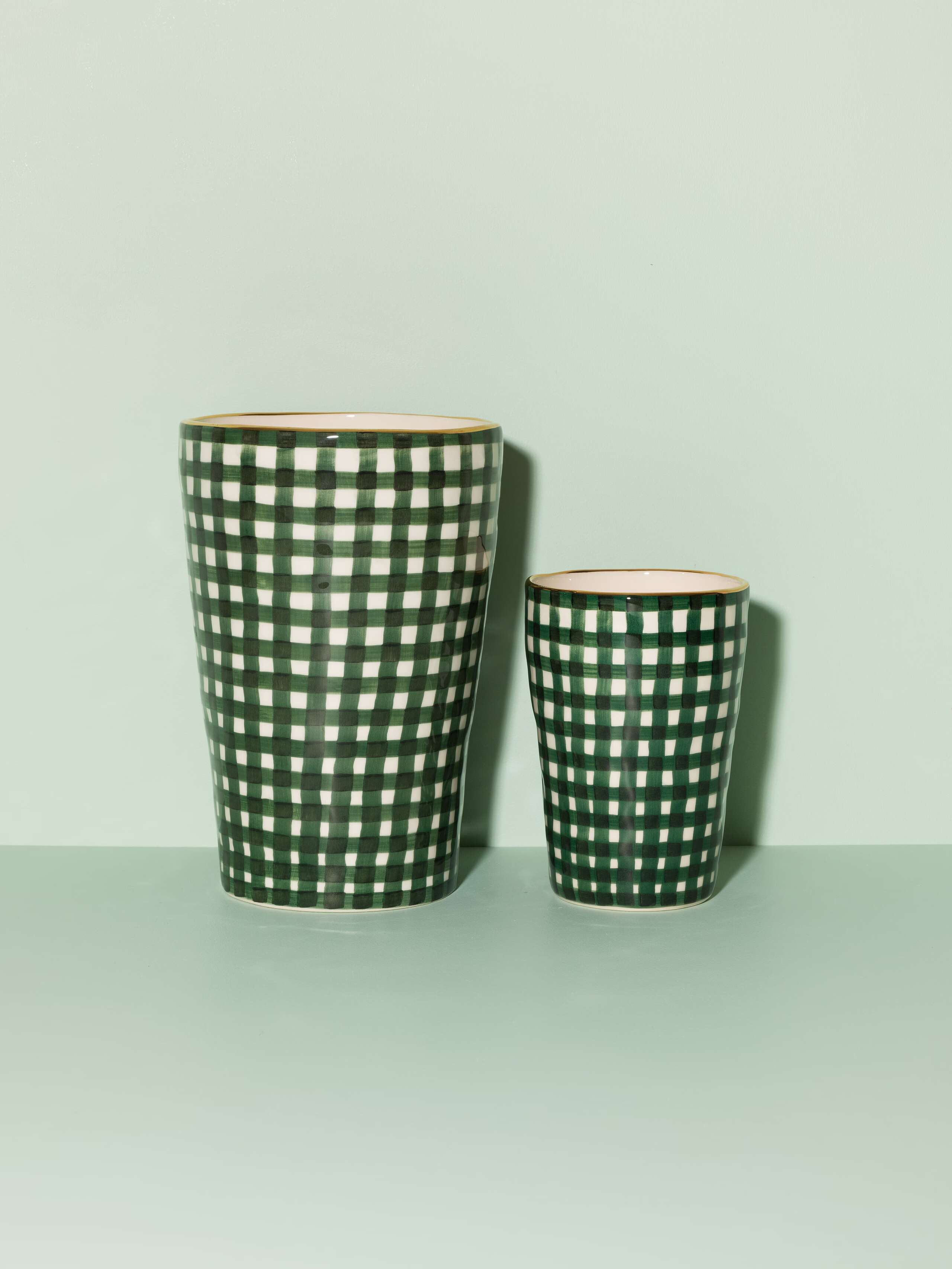 Picture of two vases featuring a green vichy check pattern