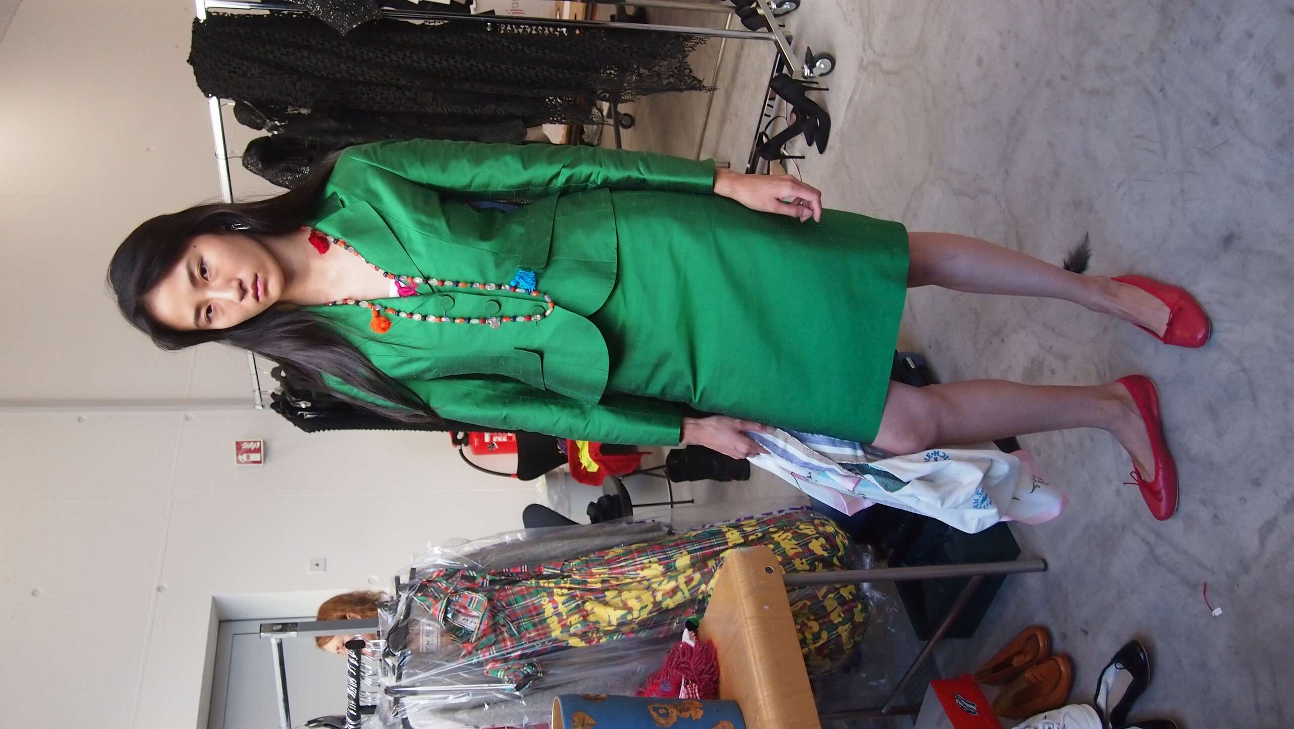 Picture of a model in the backstage of a fashion show
