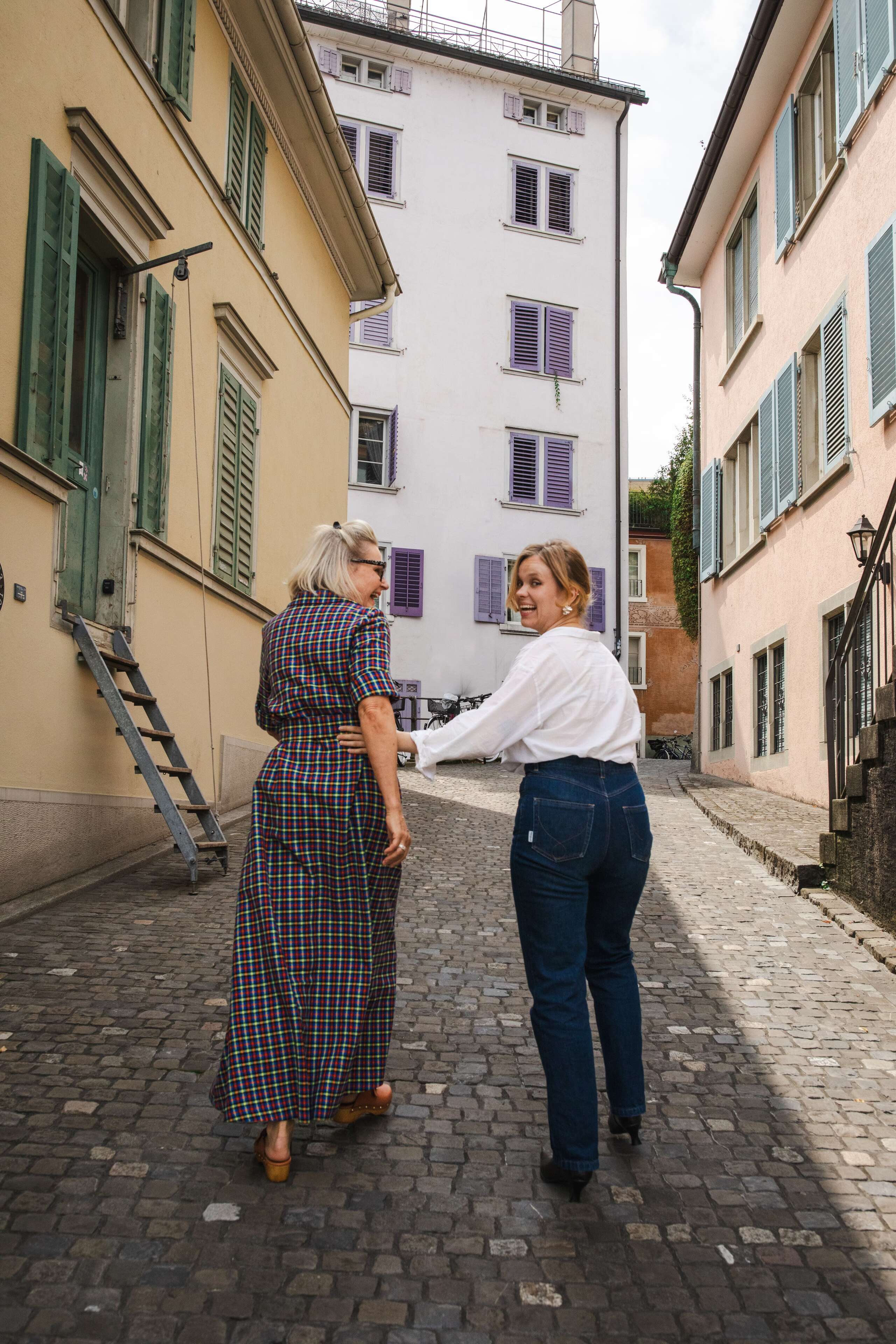 Picture of two women walking down a street