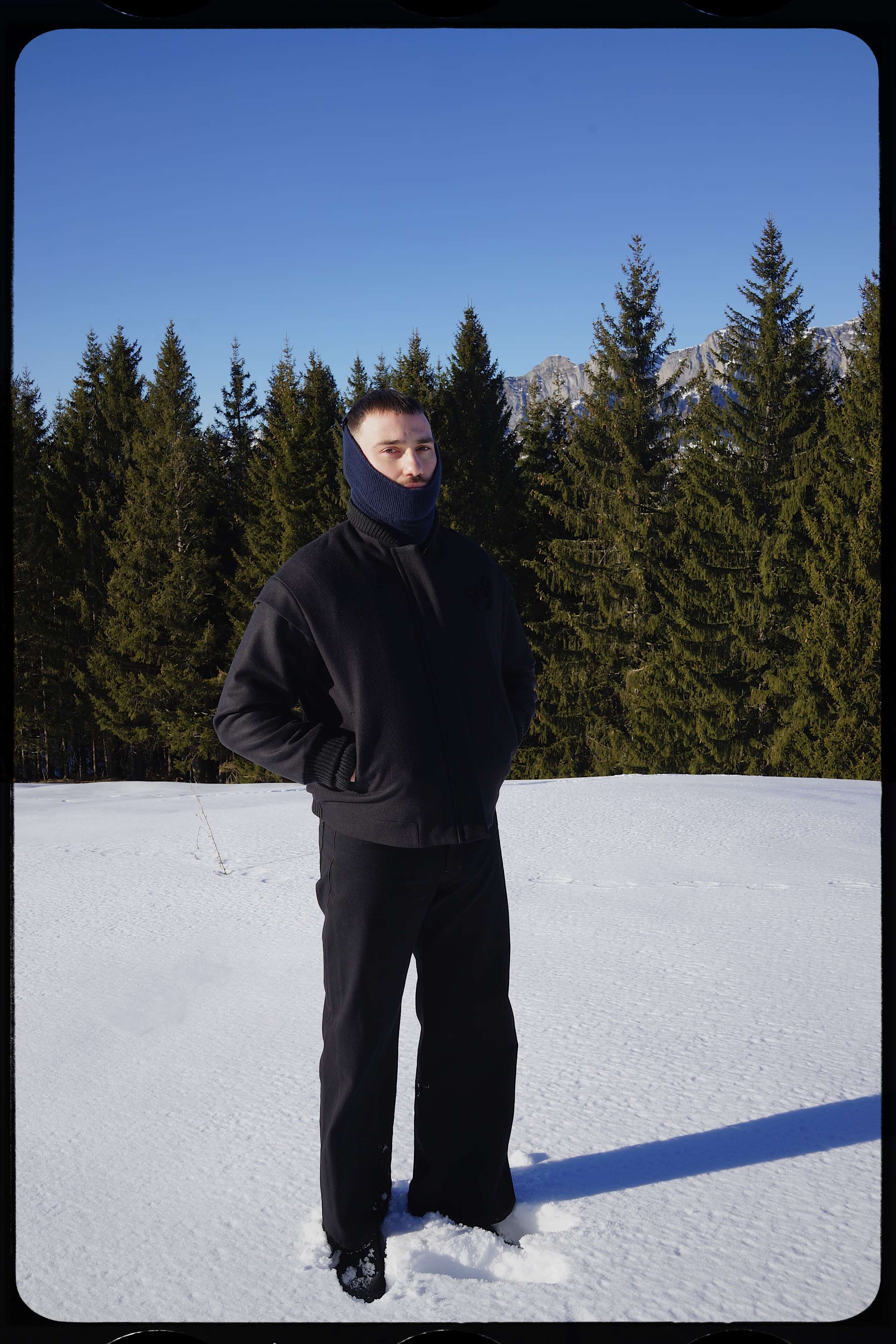 Picture of a young men standing in snow