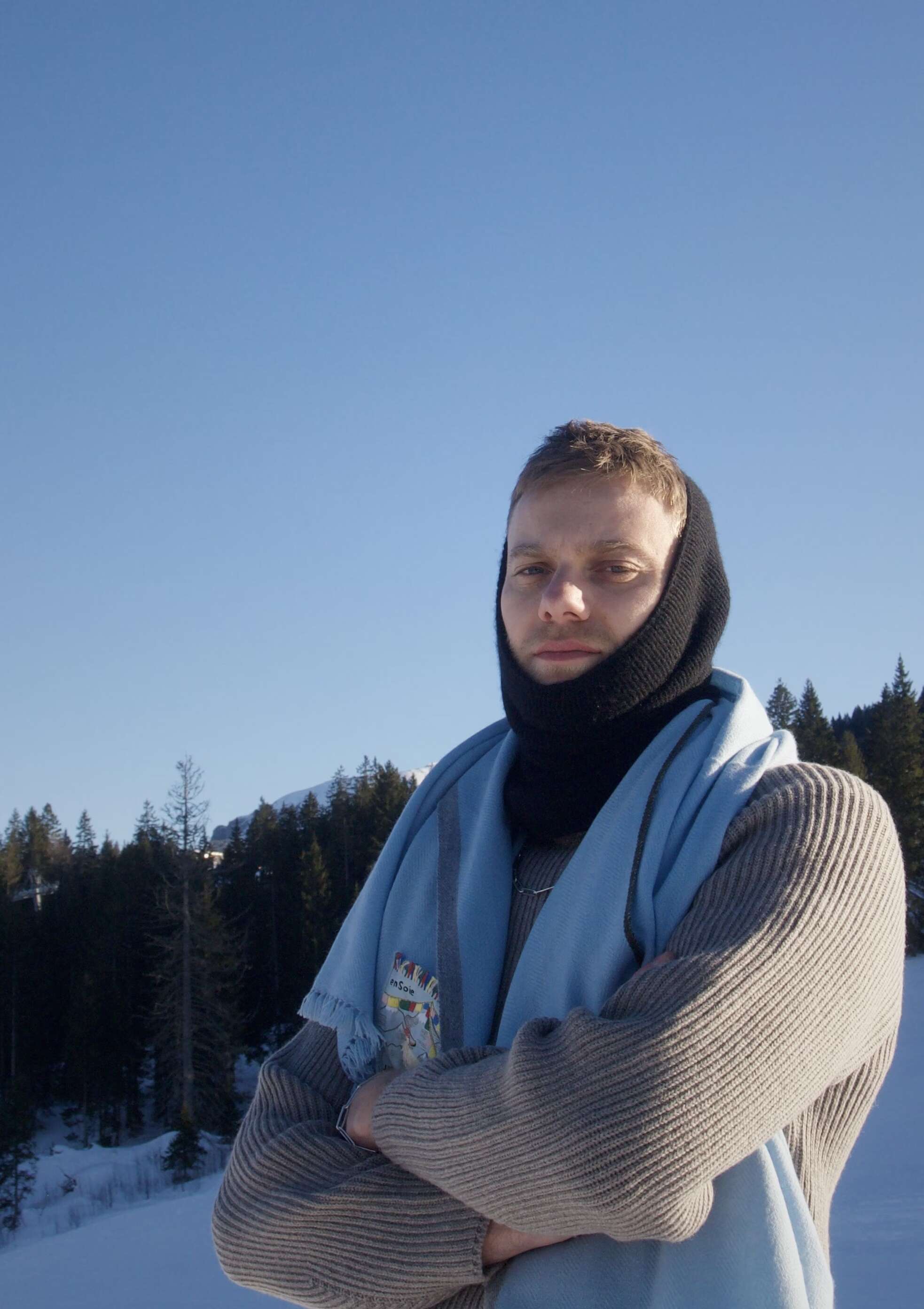 Picture of a young men standing in snow.