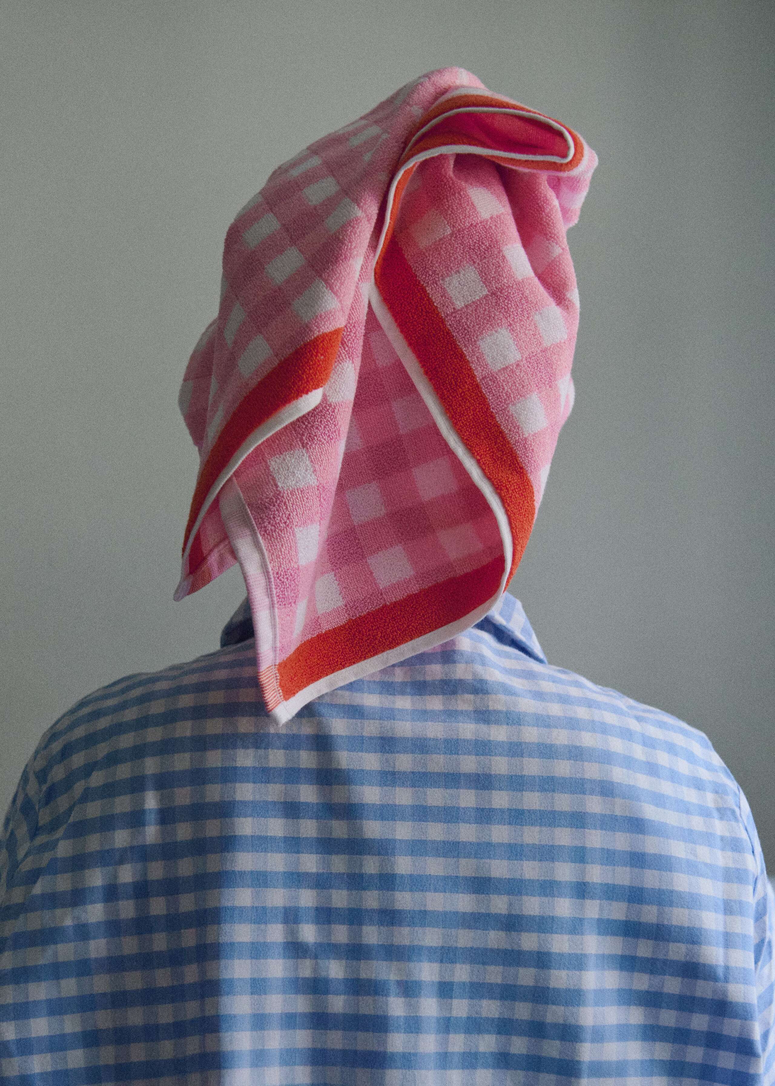 Picture of a women waving her hair in a pink bath towel