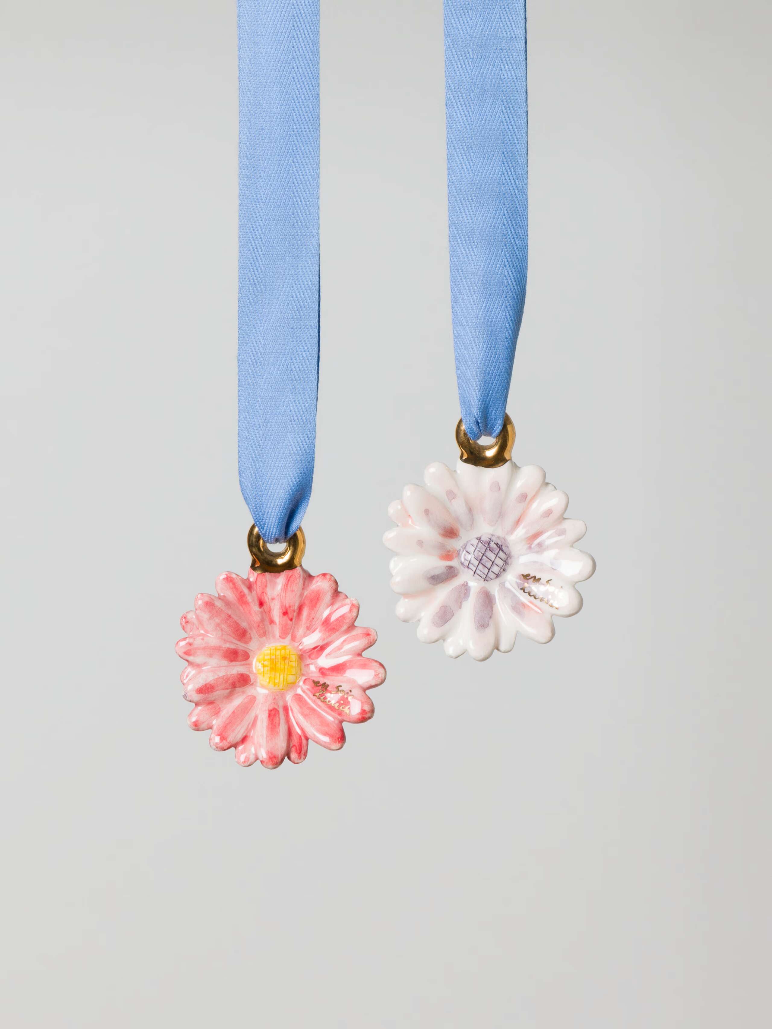 Ceramic flower ornament in red and pink shades