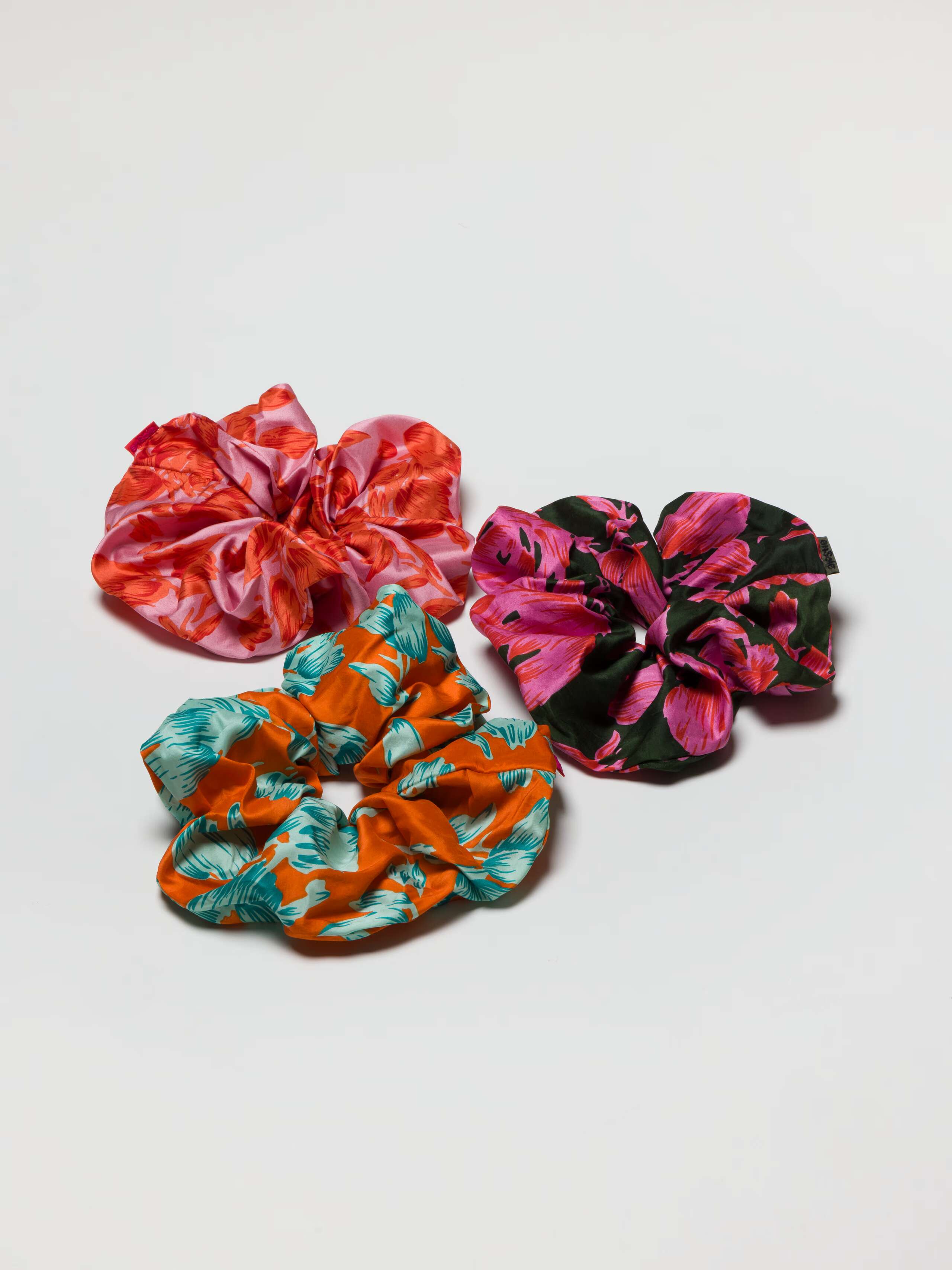 Scrunchie Rose oversize accessory in Flower print silk in three colours pink orange pink khaki green and teal orange