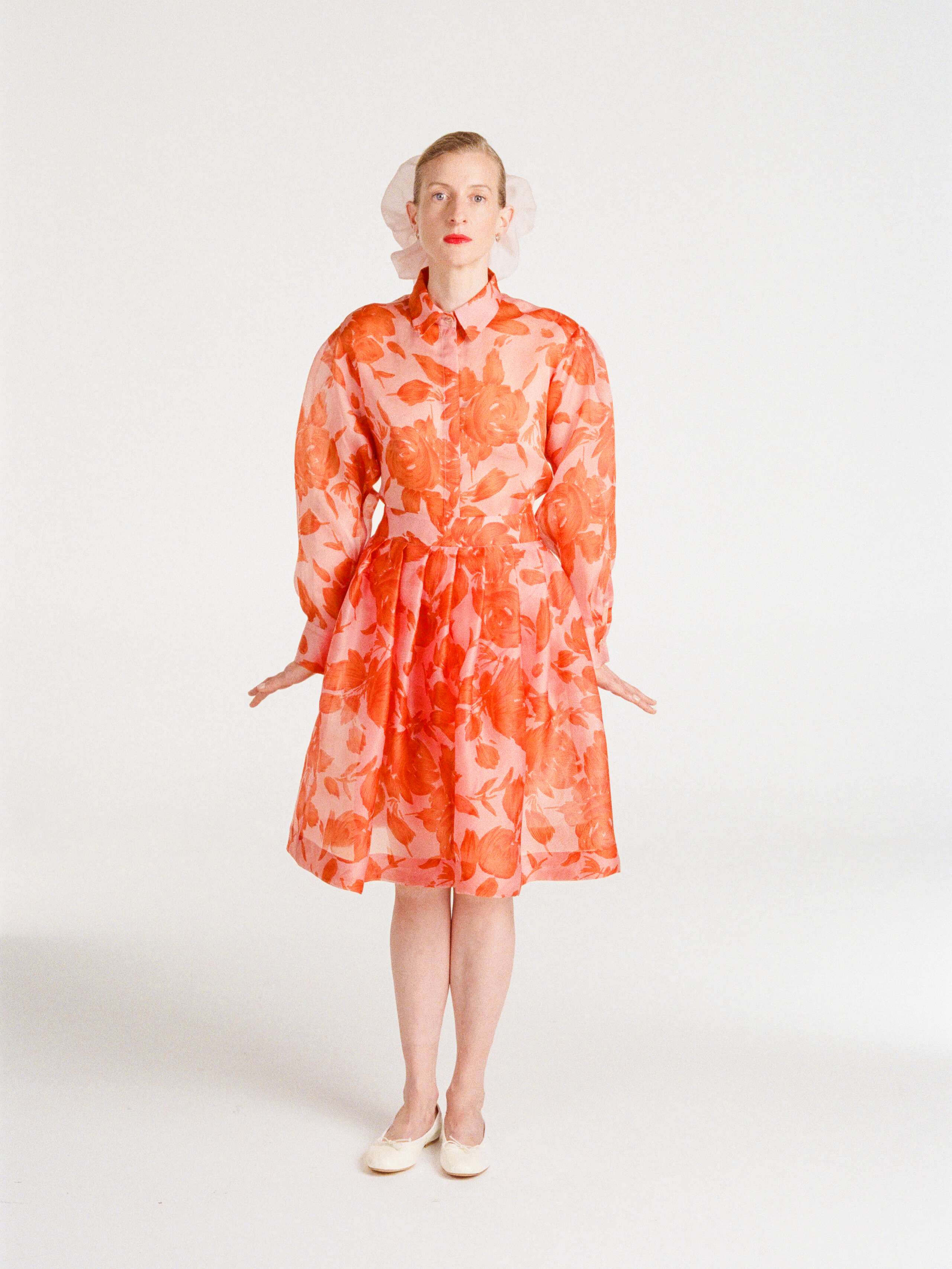 Sophie wearing the printed flower organza skirt with pink and orange
