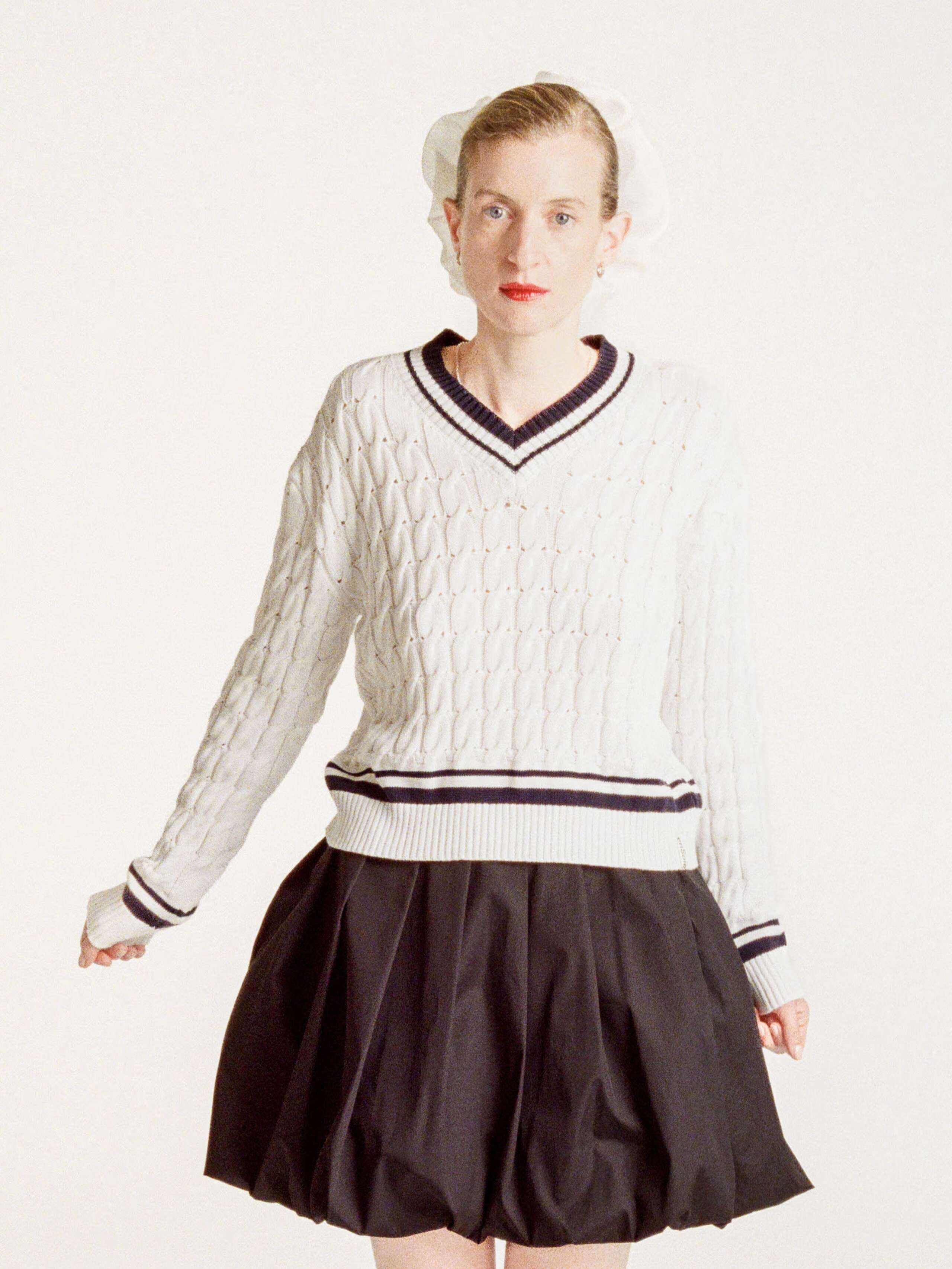 Sophie wearing the John sweater in white