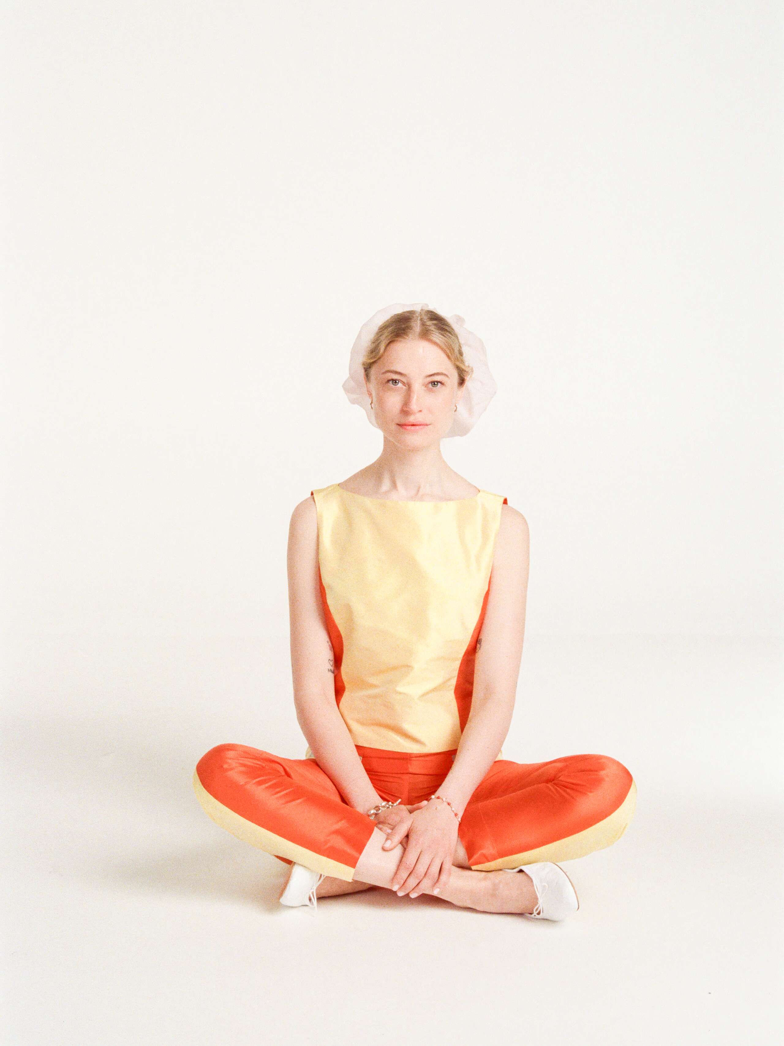 Anna wearing the doupion silk Bea top in yellow and orange colourblock mix