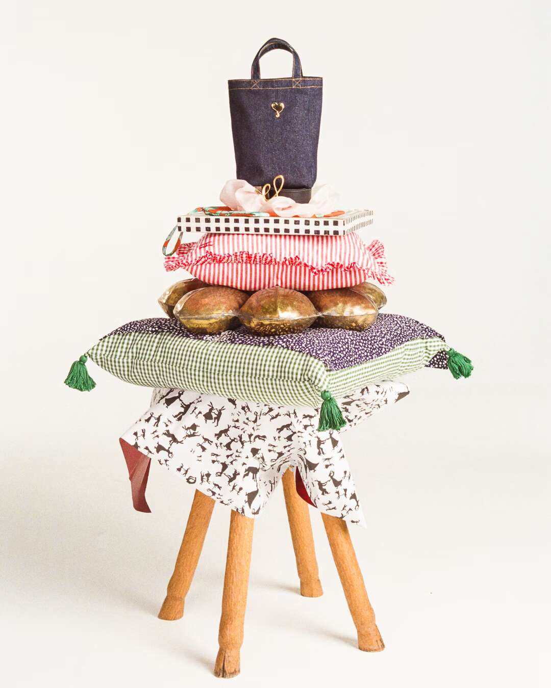 Picture of a pile of pillows and accessories on a chair