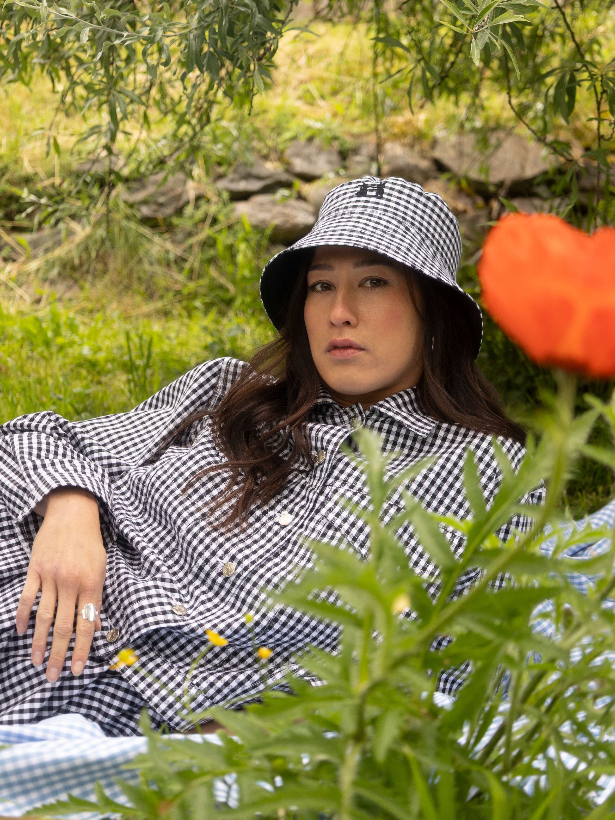 Picture of a women wearing black vichy check