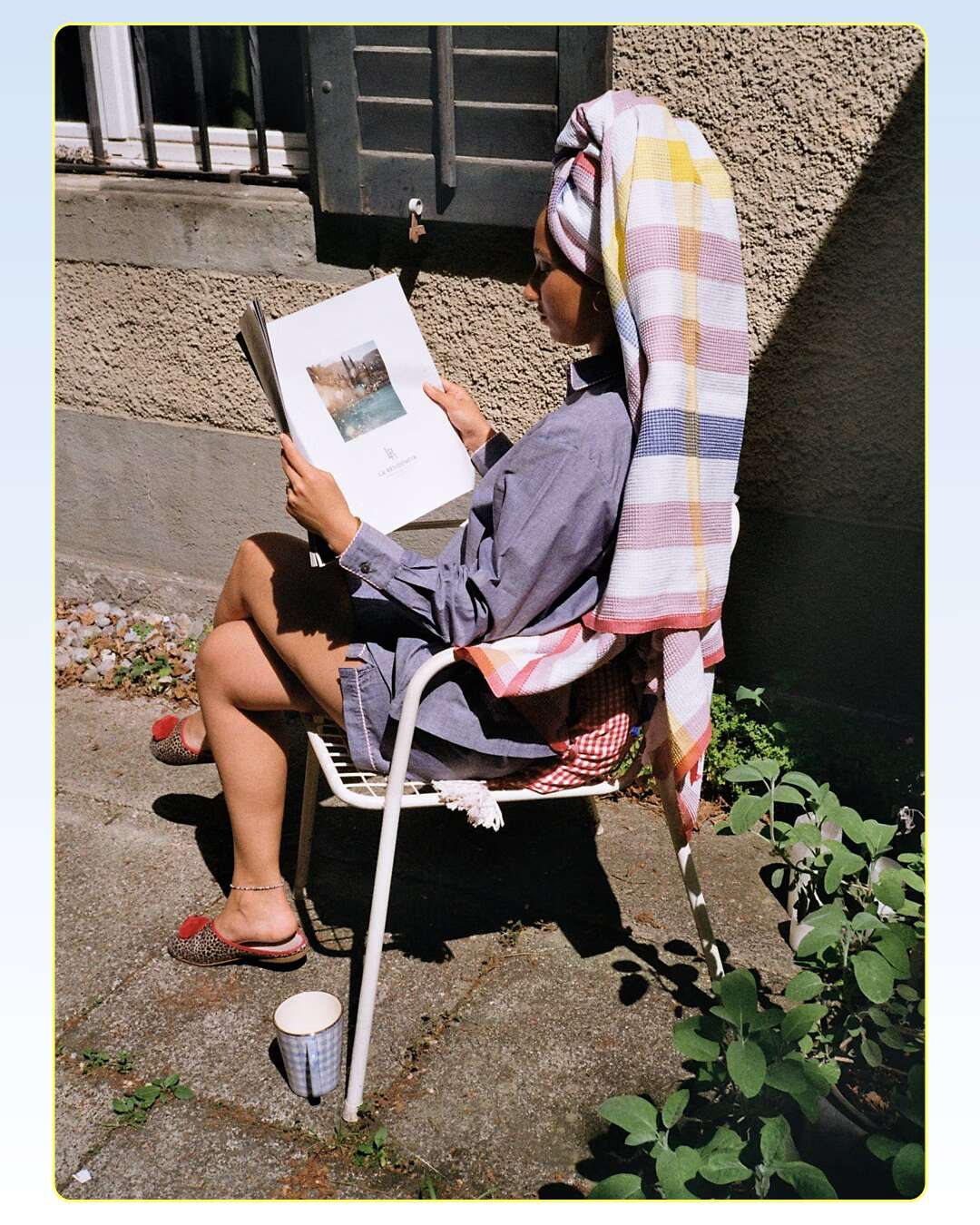 Picture of a young women sitting in a chair in the sun