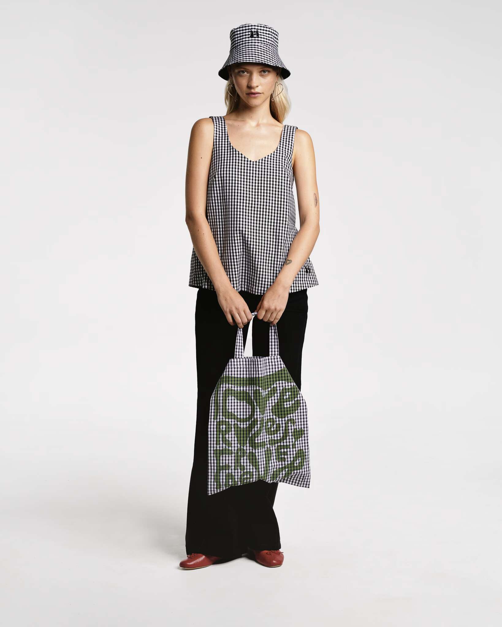 Models wearing the Tia top sleeveless in red vichy check and black vichy check