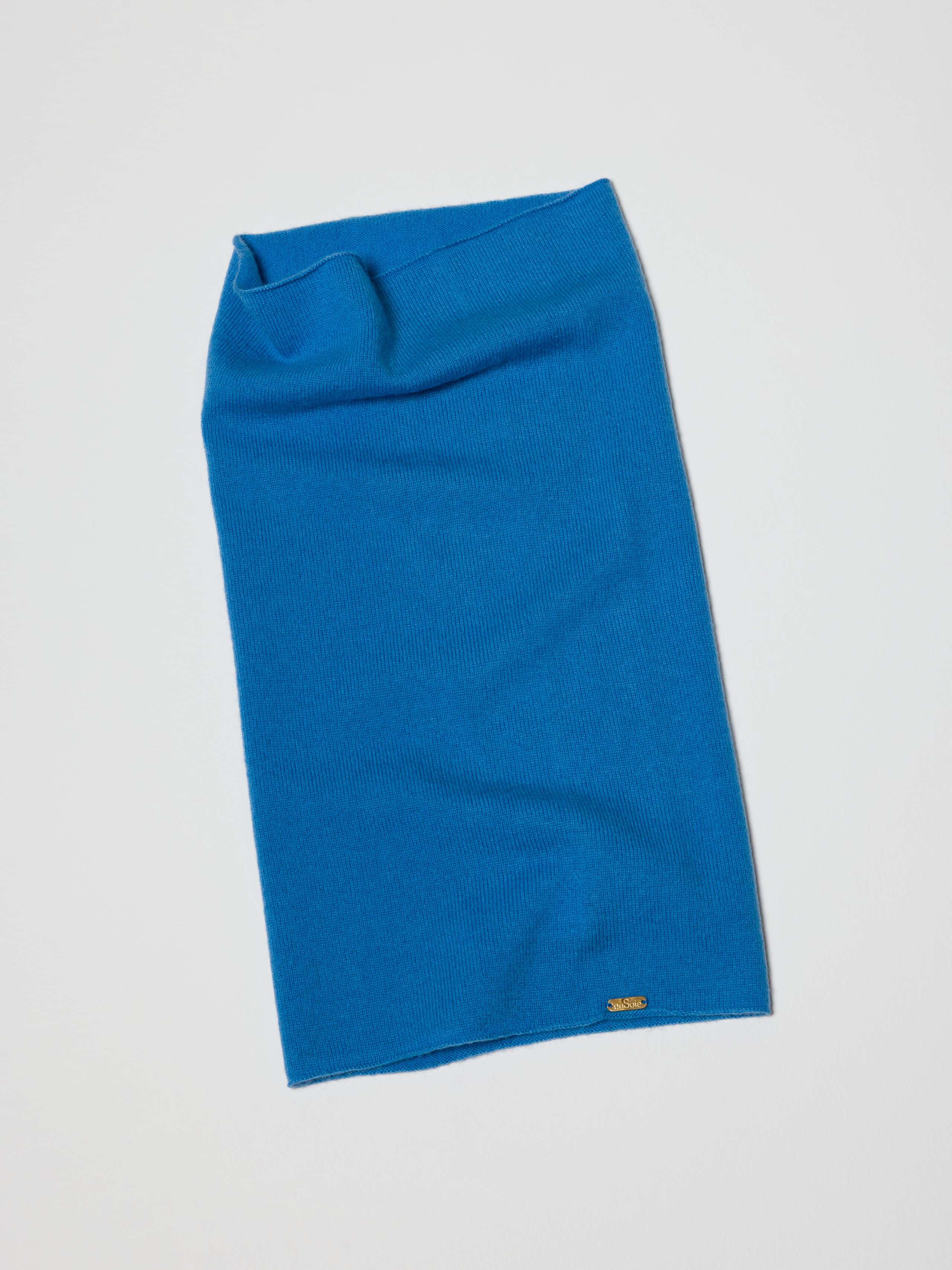 Picture of a blue fine knit tube hat made from finest wool and cashmere
