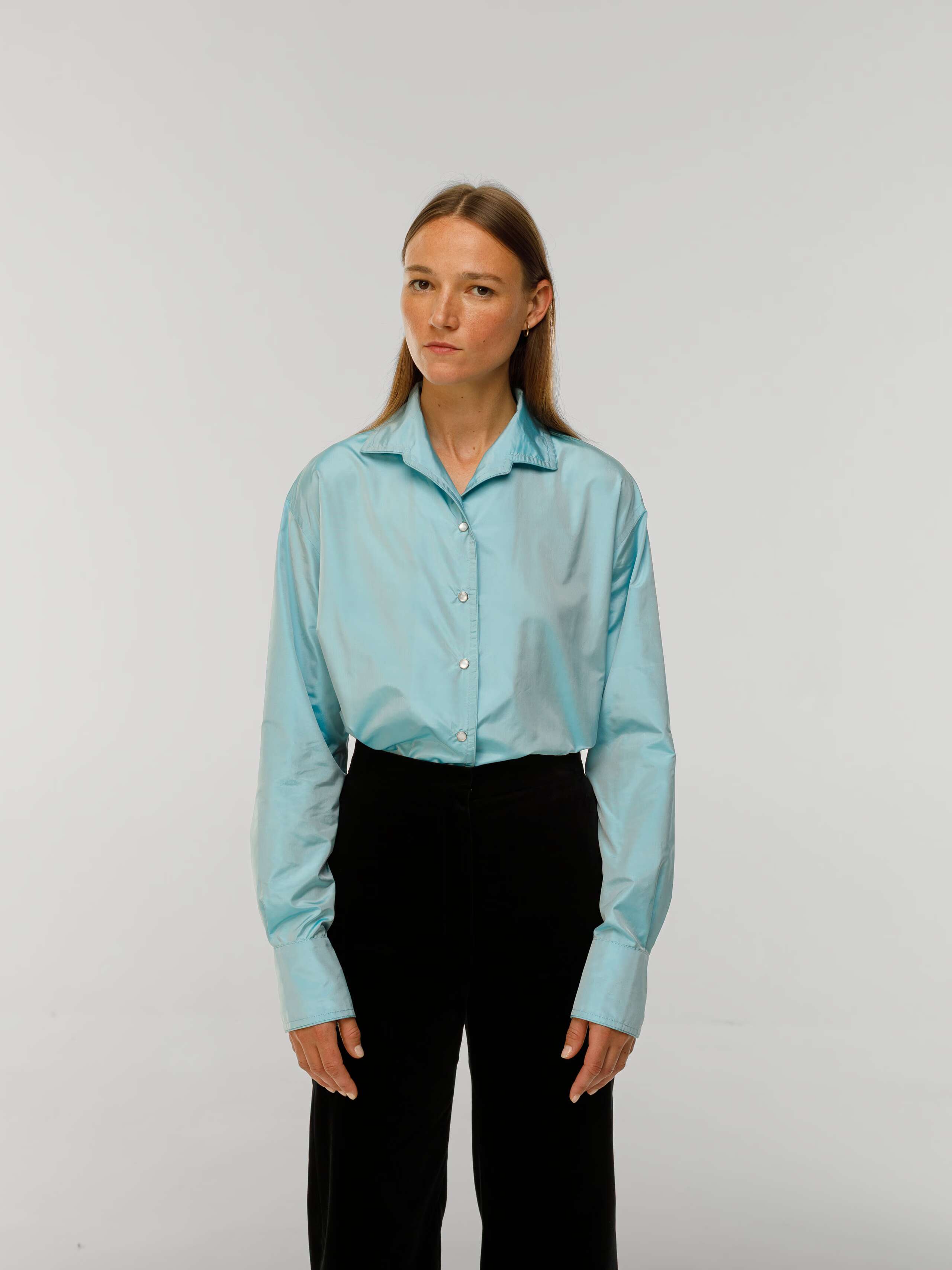 Malin Blouse in funky blue Taffeta silk worn by model