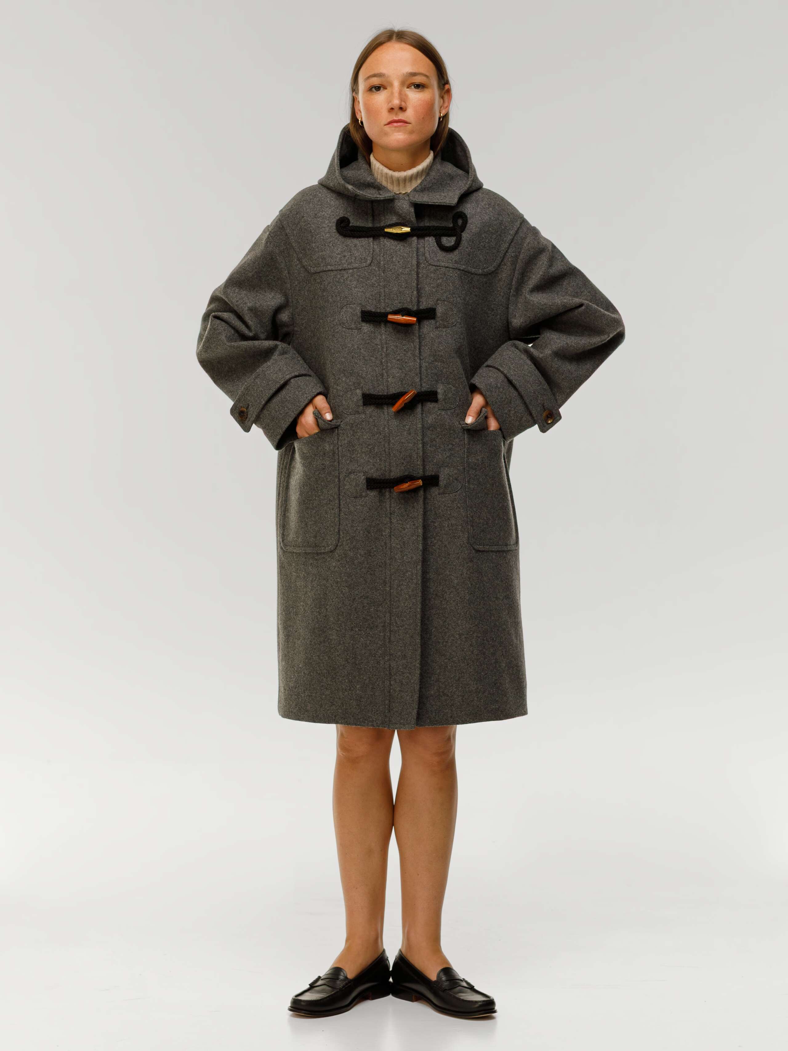 Otis coat in cloud grey worn by female model